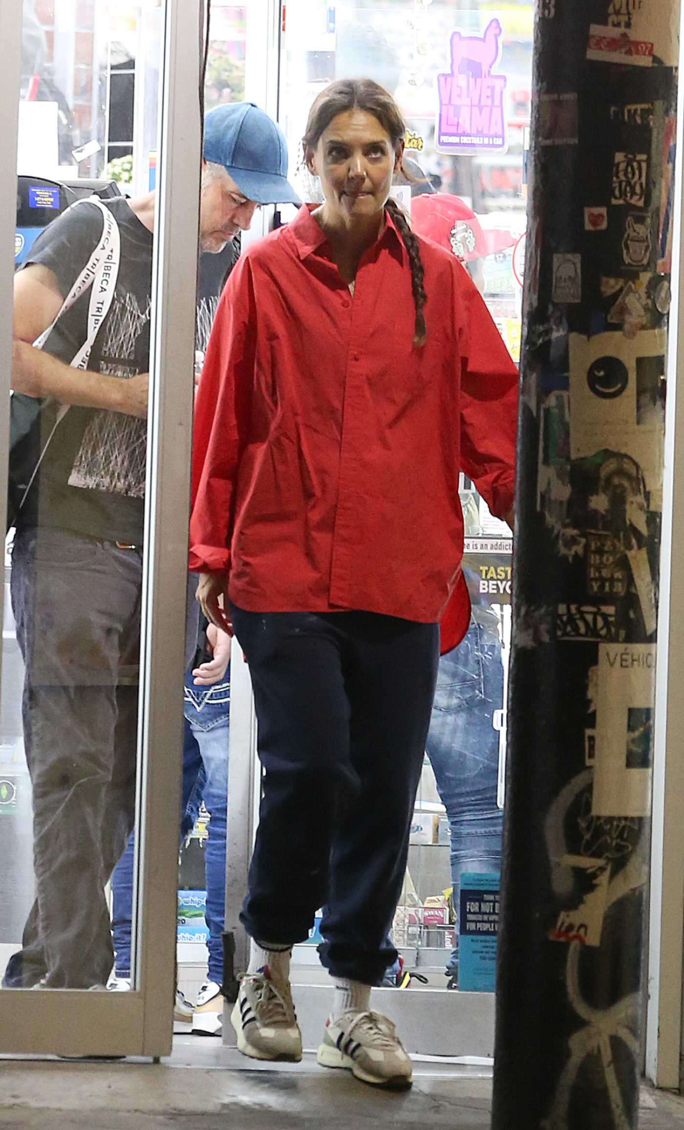 Katie Holmes in a Red Shirt Was Spotted Out with a Male Friend in NYC 09/13/2023