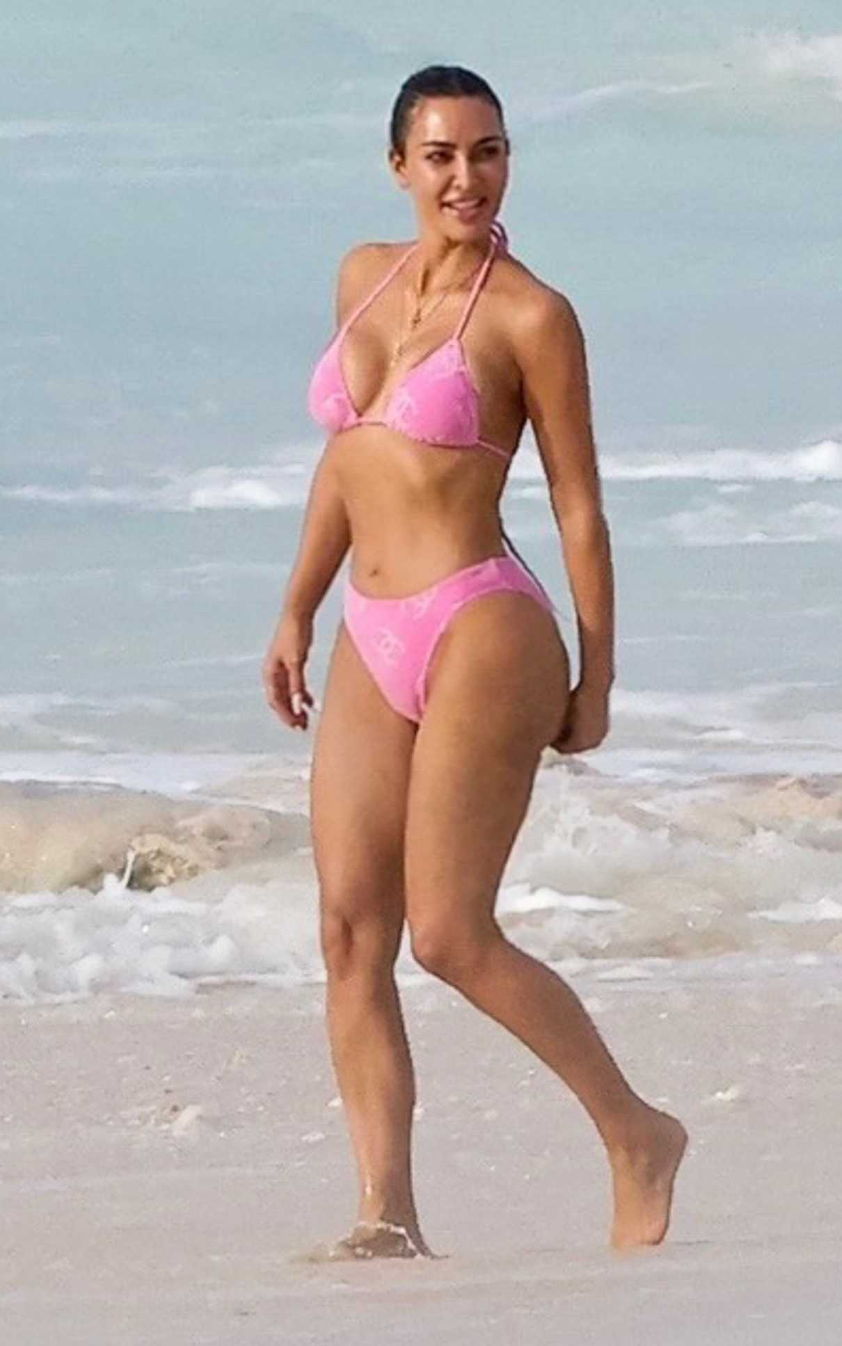 Kim Kardashian in a Pink Bikini During a Vacation in Turks and Caicos 09/07/2023