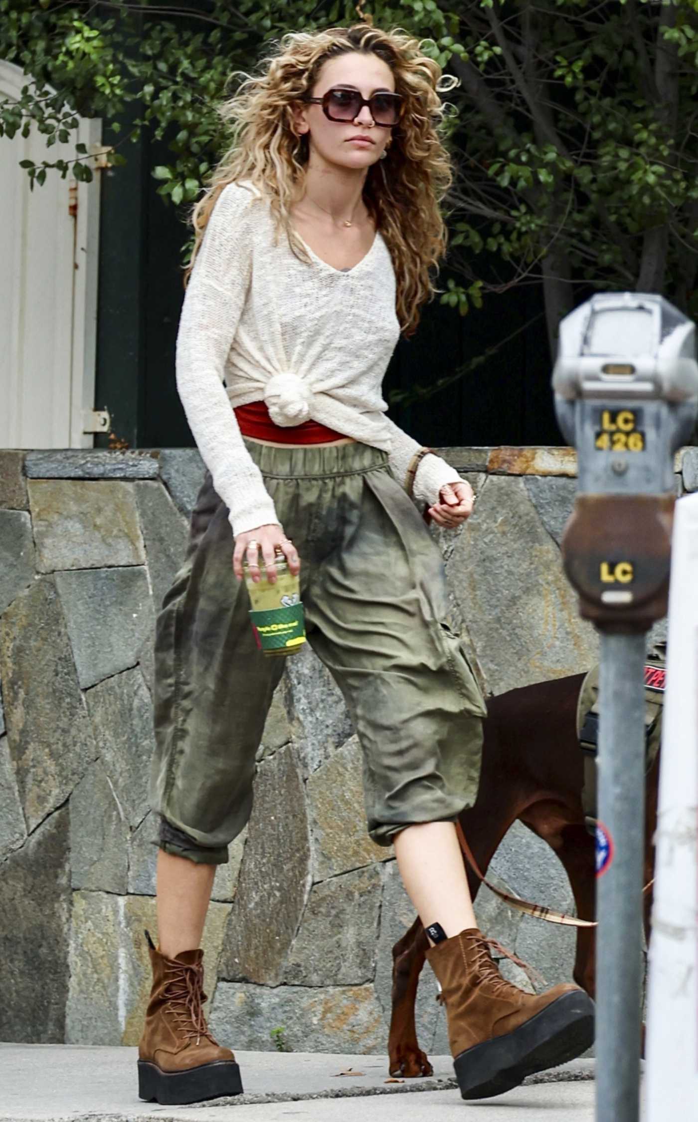 Paris Jackson in a Brown Boots Strolls Leisurely with Her Dog Through the Streets of Los Angeles 09/02/2023