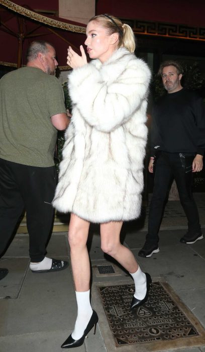 Stella Maxwell in a White Fur Coat