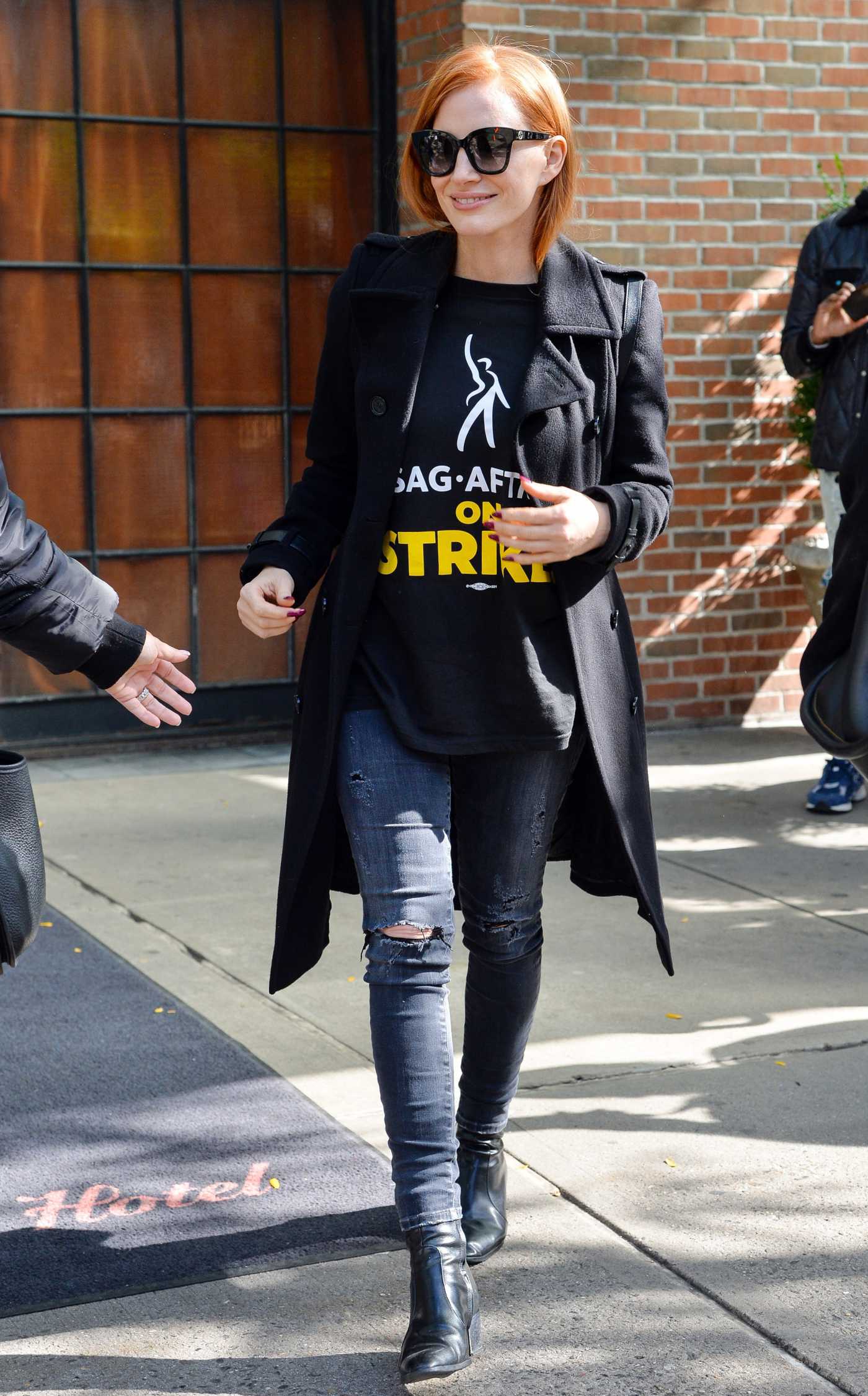 Jessica Chastain in a Black Coat Attends Attends the SAG-AFTRA and WGA Strike in New York 10/16/2023