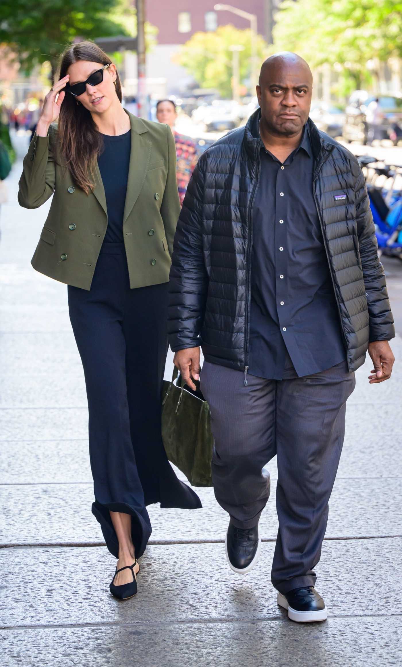 Karlie Kloss in an Olive Blazer Was Seen During a Street Stroll with Her Bodyguard in New York 10/10/2023