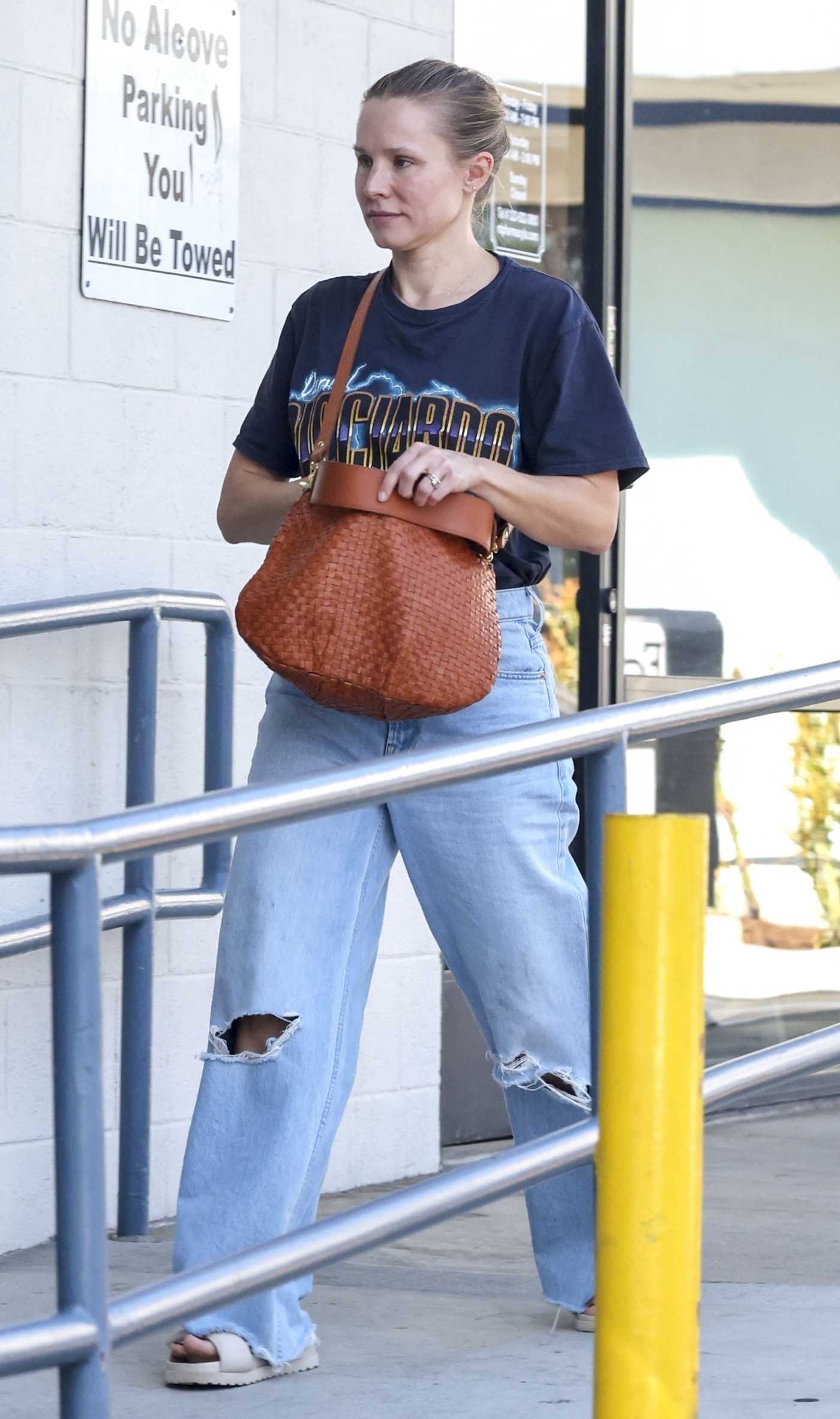 Kristen Bell in a Blue Ripped Jeans Makes a Quick Stop at Local Pharmacy in Los Feliz 10/22/2023