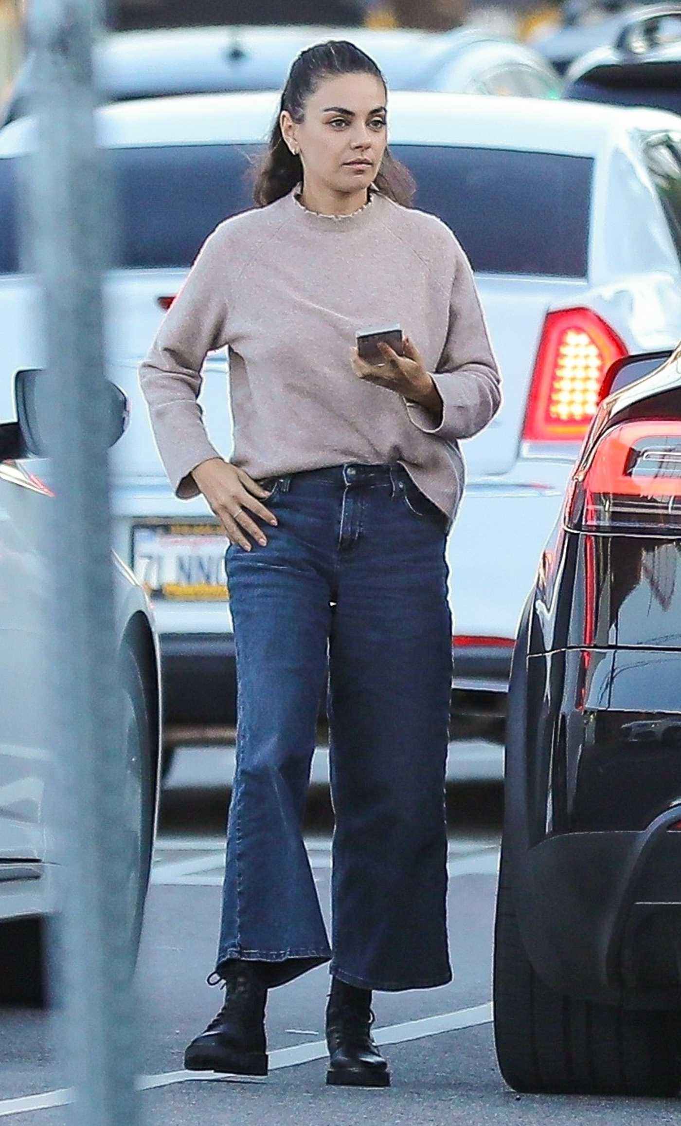 Mila Kunis in a Blue Jeans Arrives at The Nice Guy in West Hollywood 10/03/2023
