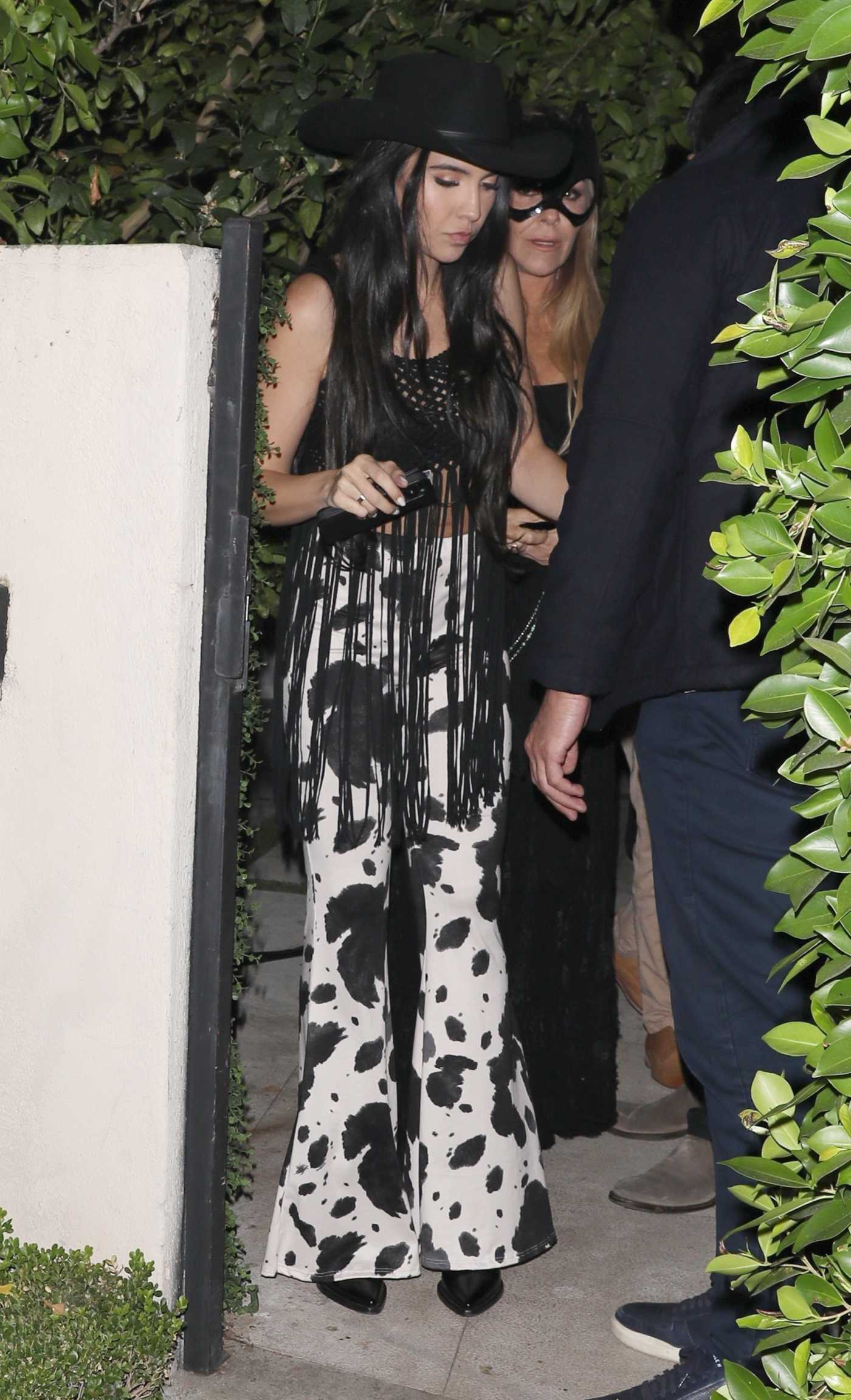 Noor Alfallah in a Black Cowboy Hat Arrives at a Casamigos Halloween Party in Los Angeles 10/27/2023