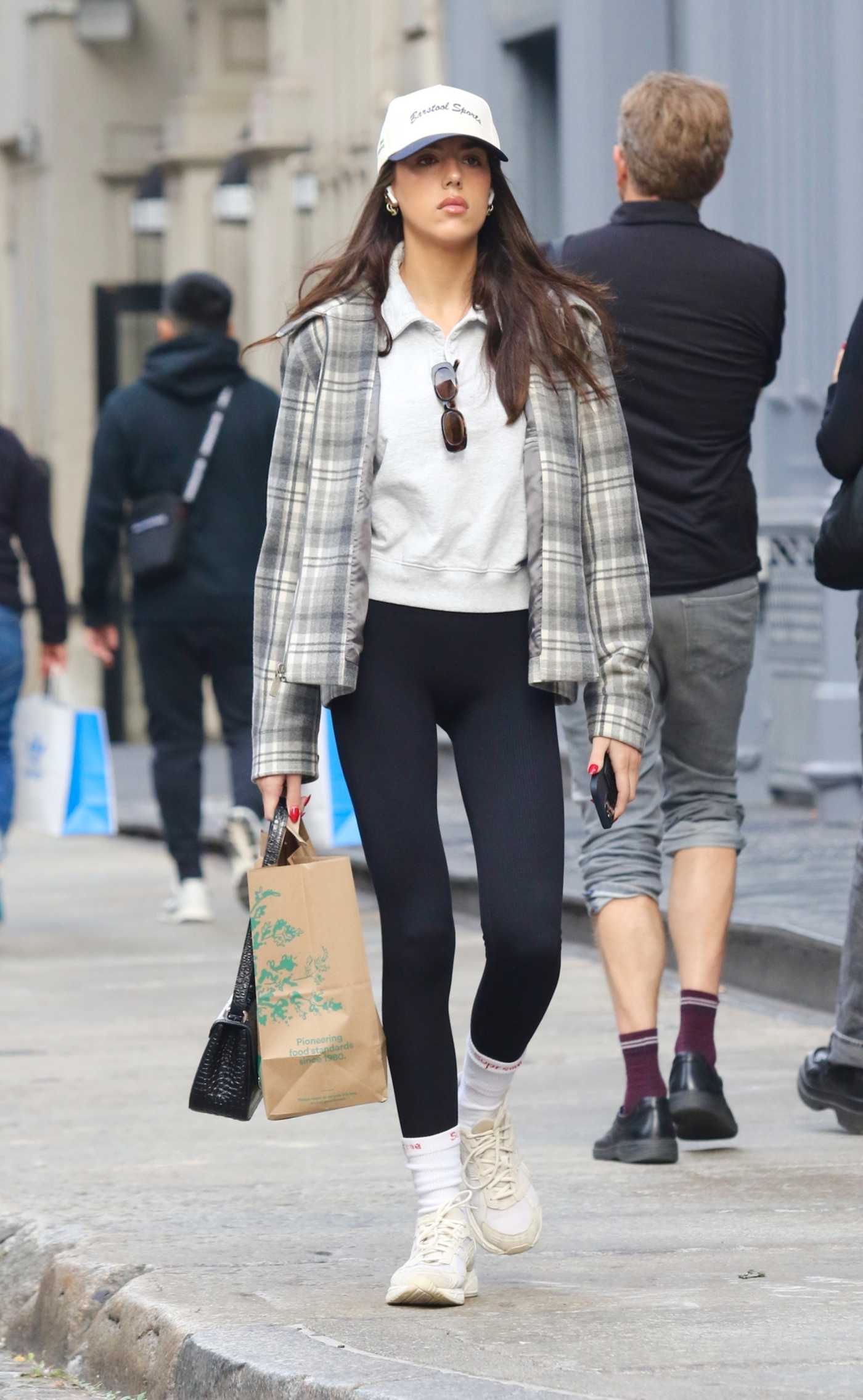 Sistine Stallone in a Plaid Jacket Was Seen After Shopping at Whole Foods Supermarket in Downtown Manhattan in NYC 10/19/2023