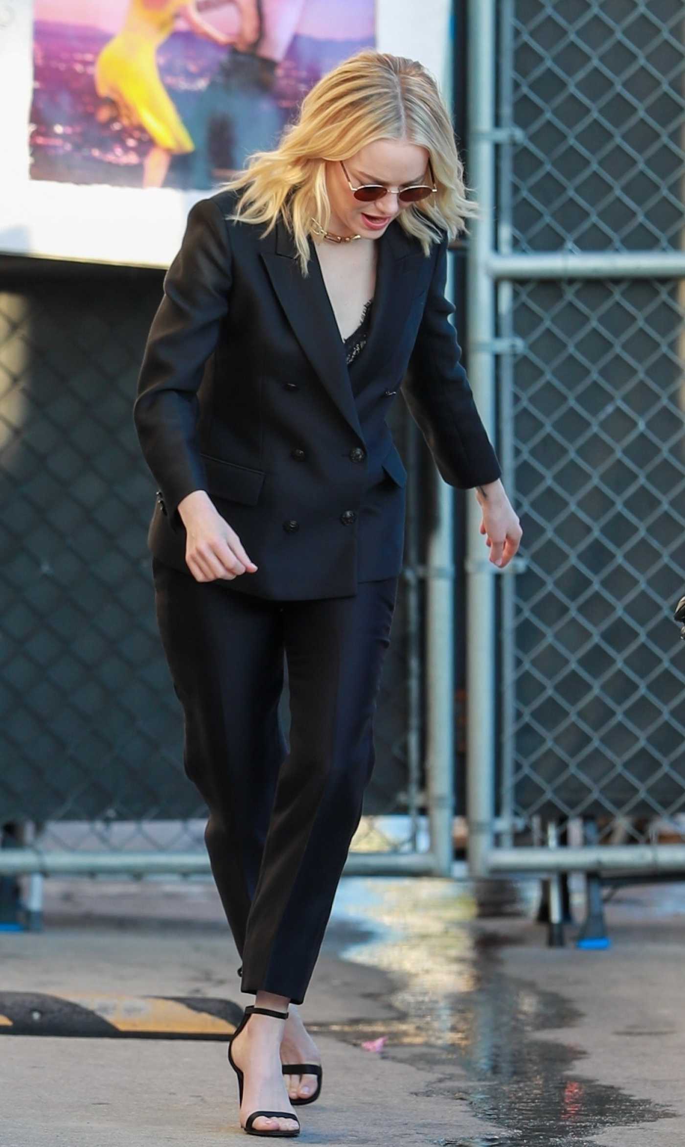 Emma Stone in a Black Pantsuit Arrives for a Taping of Jimmy Kimmel Live in Los Angeles 11/16/2023