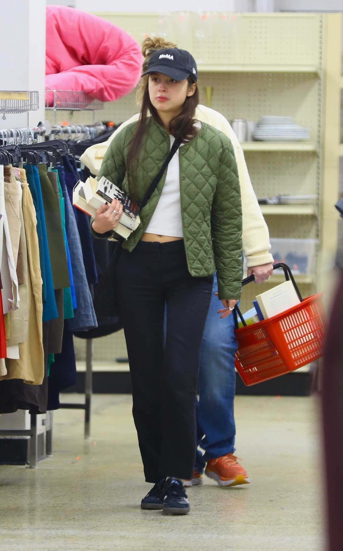 Olivia Rodrigo in an Olive Jacket Goes Shopping at a Thrift Store in New York 11/10/2023