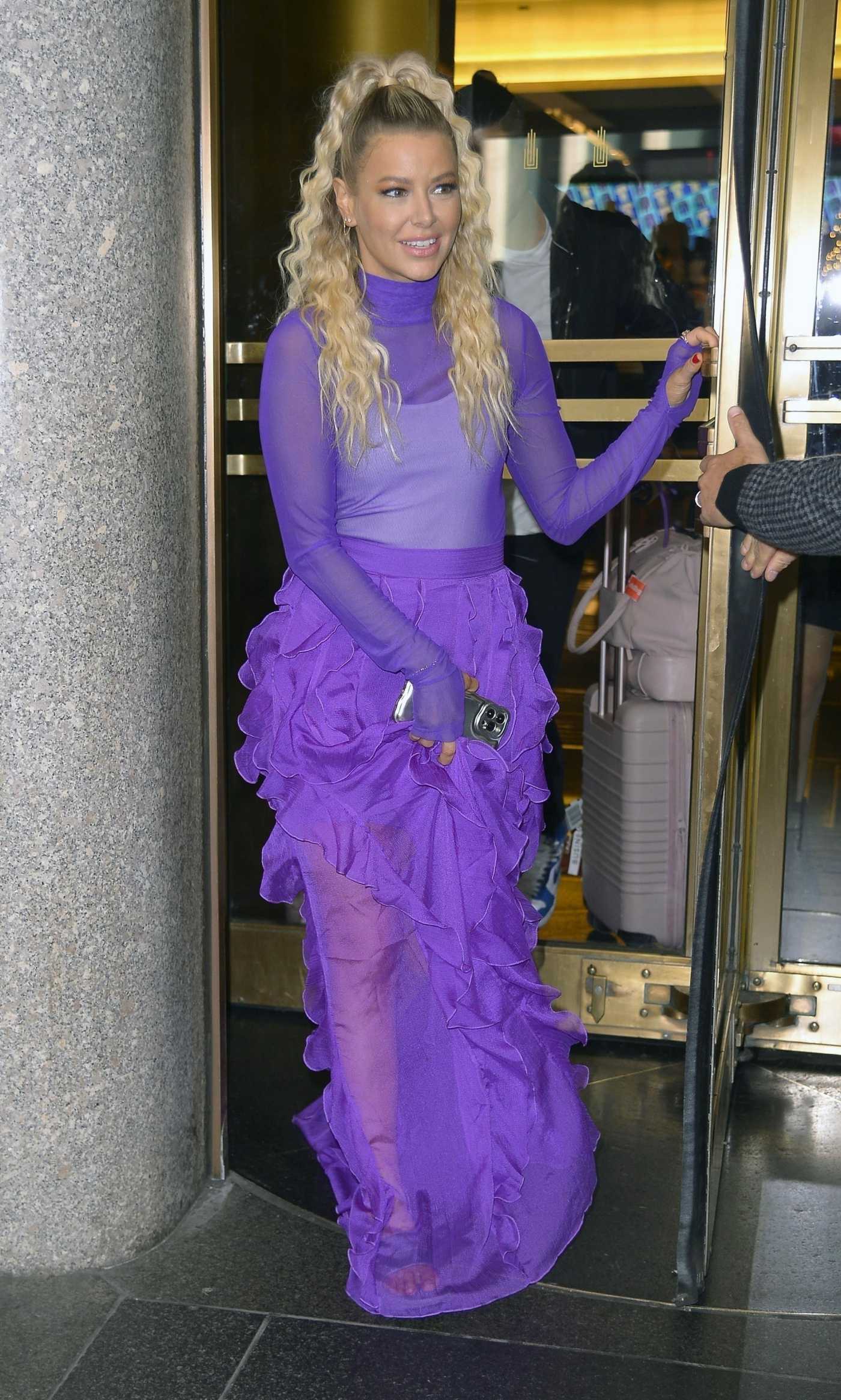 Ariana Madix in a Purple Ensemble Exits the NBC Building in New York 12/06/2023