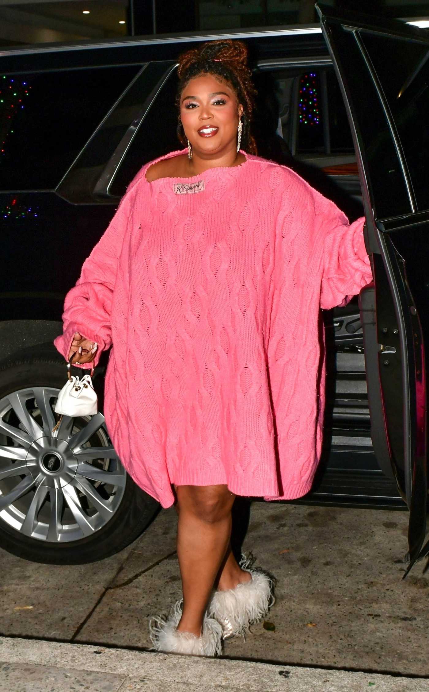 Lizzo in a Bright Pink Sweater Dress Arrives for Dinner with Friends at Celebrity Hotspot Mr Chow in Beverly Hills 12/23/2023