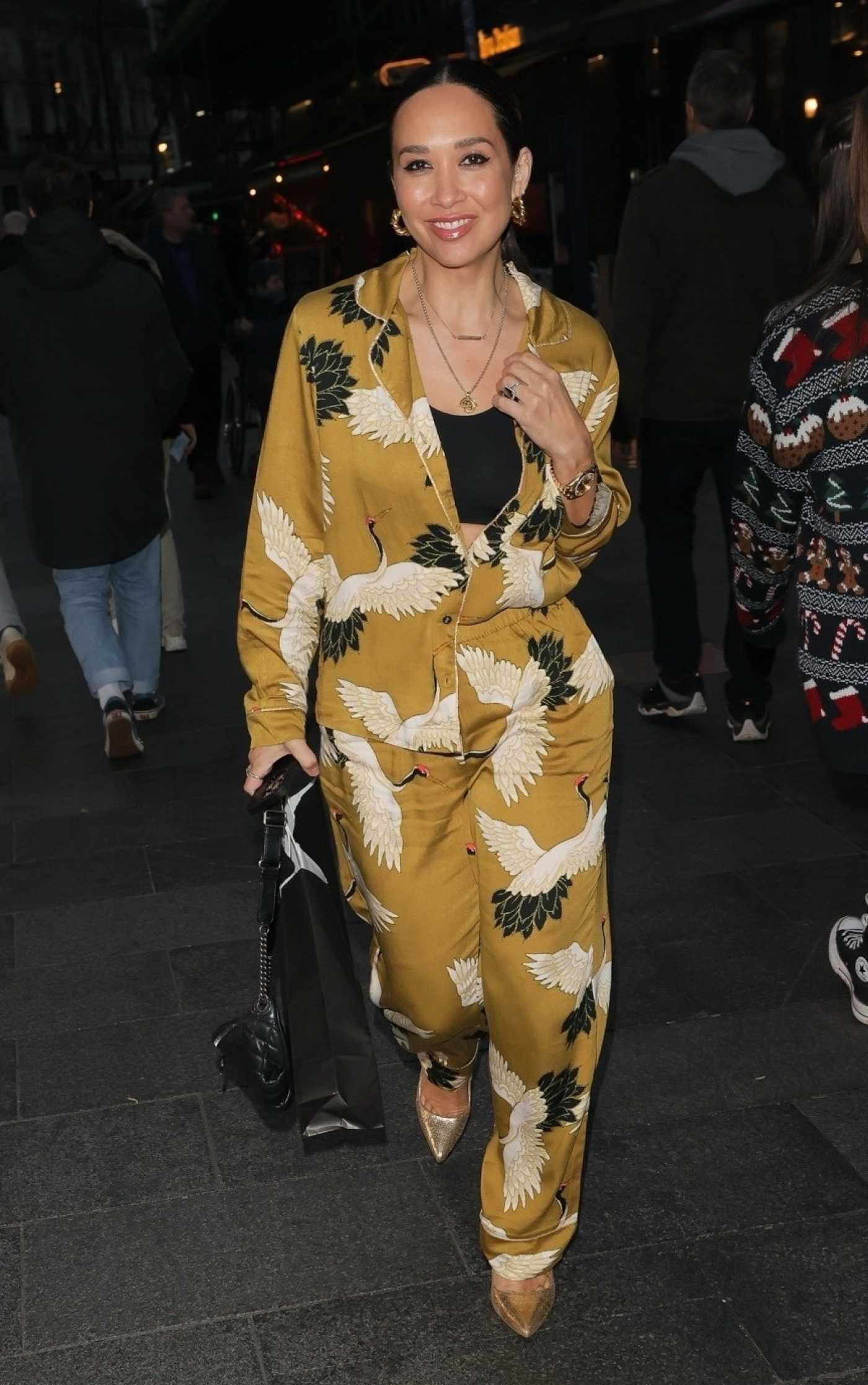 Myleene Klass in a Caramel Coloured Bright Jumpsuit Arrives at the Smooth Radioin in London 12/16/2023