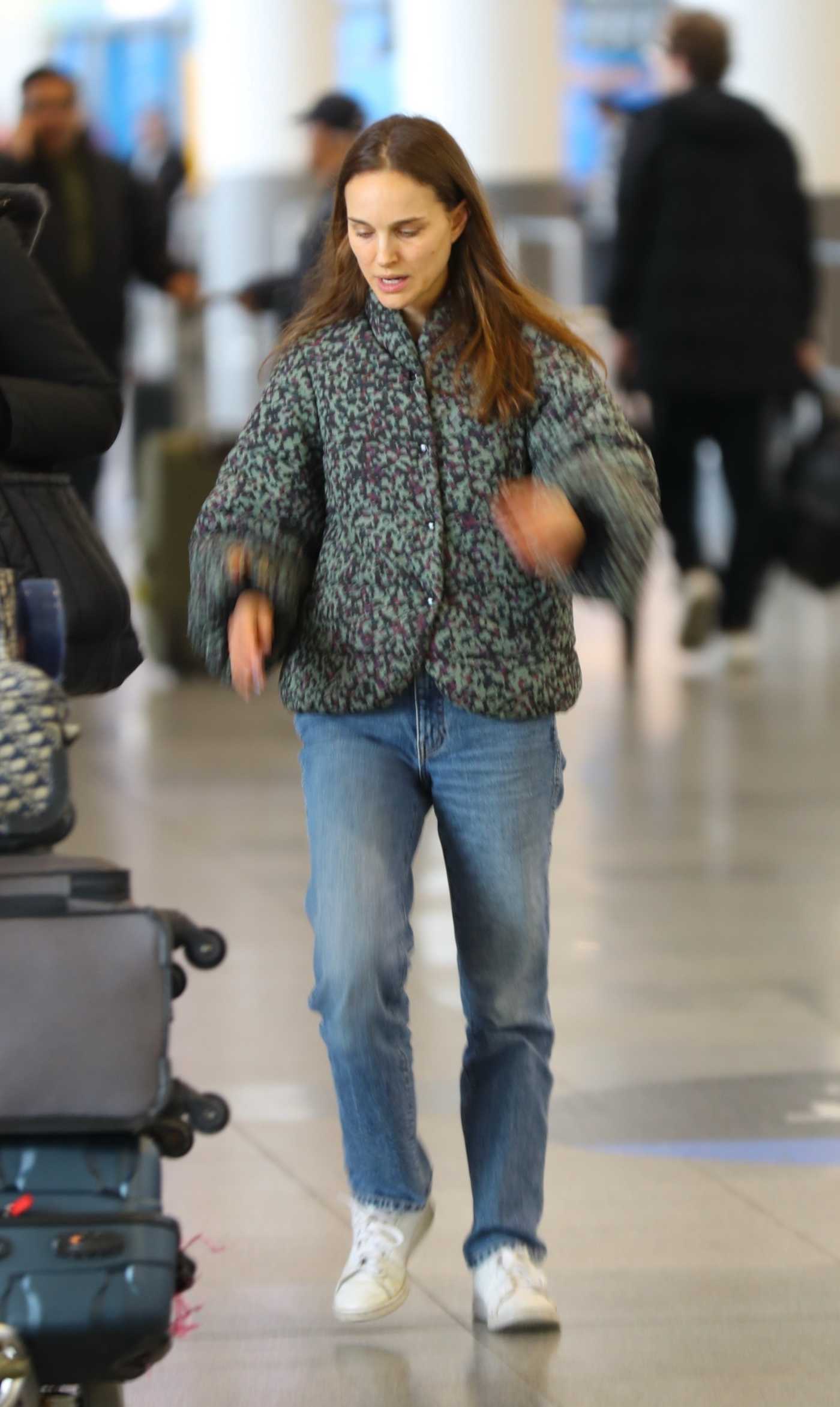 Natalie Portman in a White Sneakers Arrives at JFK Airport in New York 12/30/2023