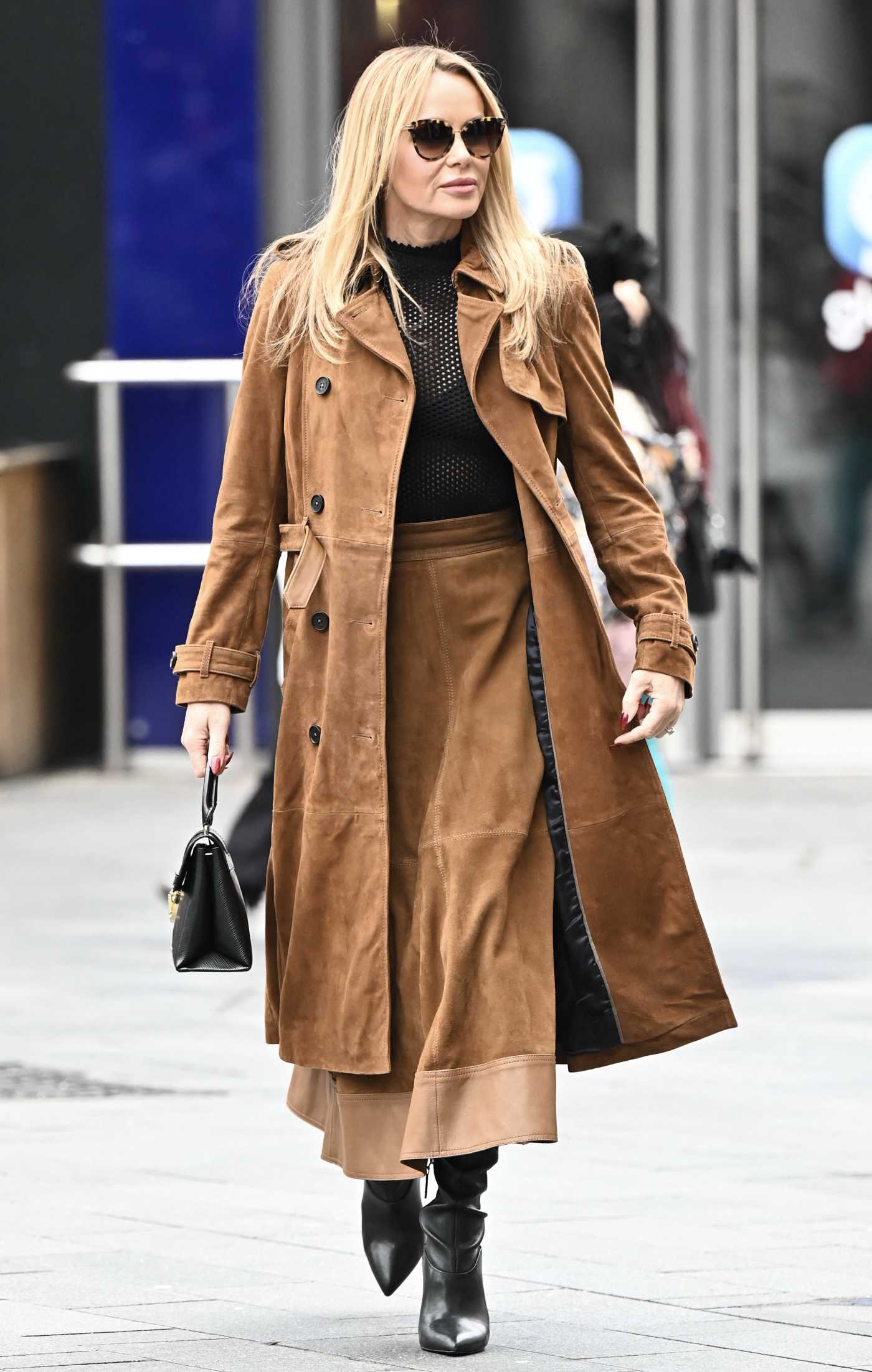 Amanda Holden in a Tan Leather Trench Coat Leaves the Global Studios Heart Breakfast Show in London 02/20/2024