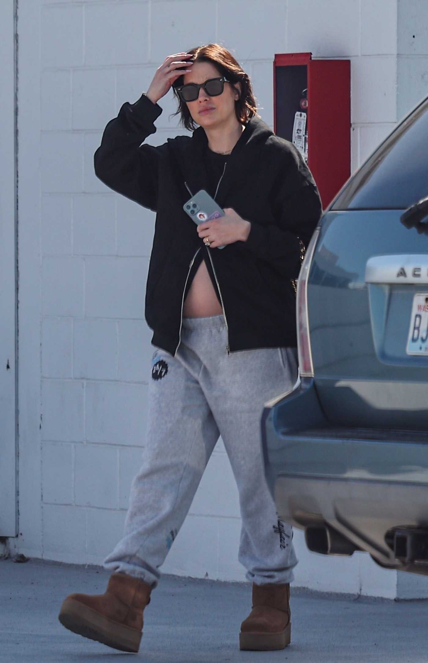 Ashley Benson in a Black Hoodie Was Seen Out with Brandon Davis in Los Angeles 02/13/2024