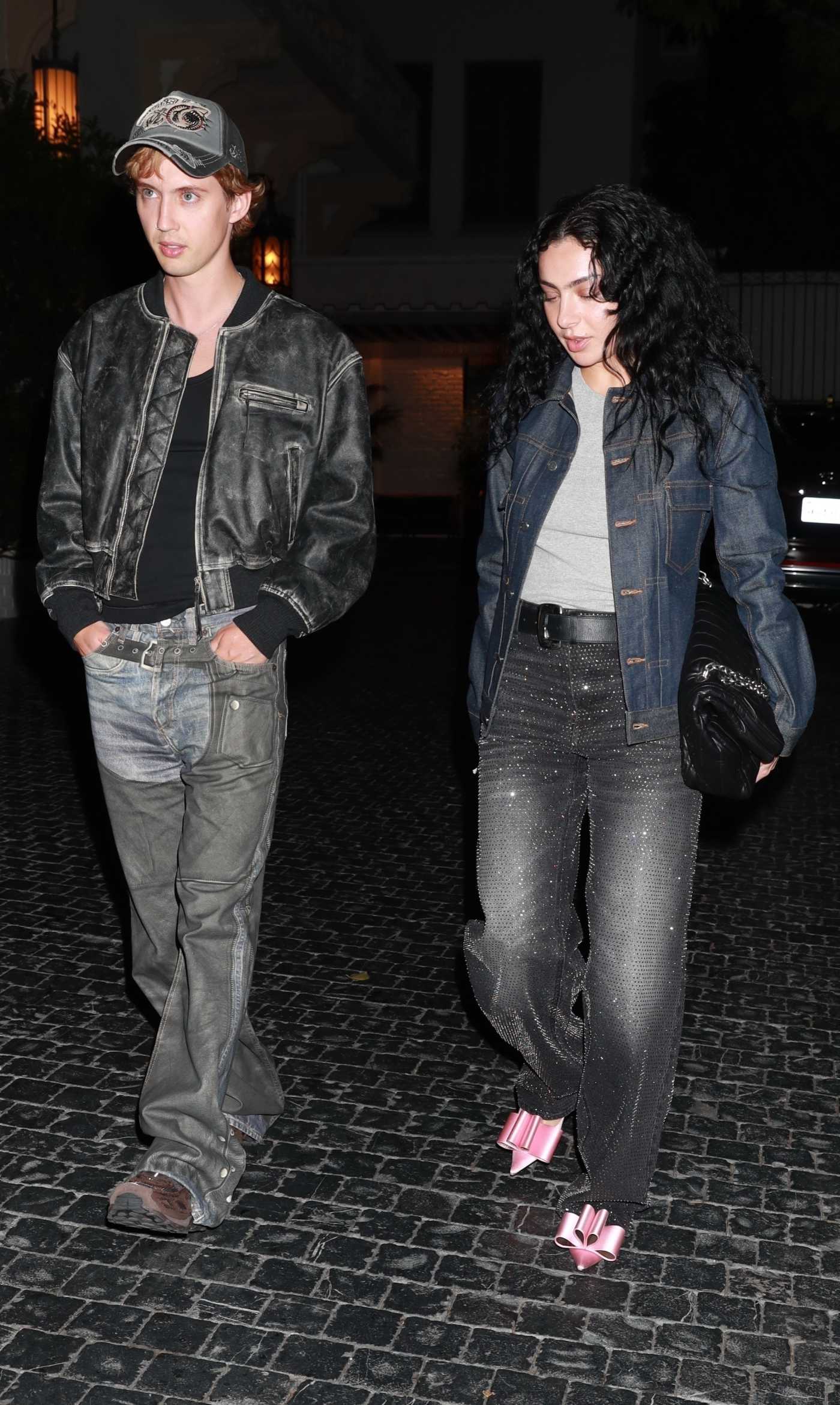 Charli XCX in a Denim Jacket Leaves Dinner with Troye Sivan at Chateau Marmont in West Hollywood 01/31/2024