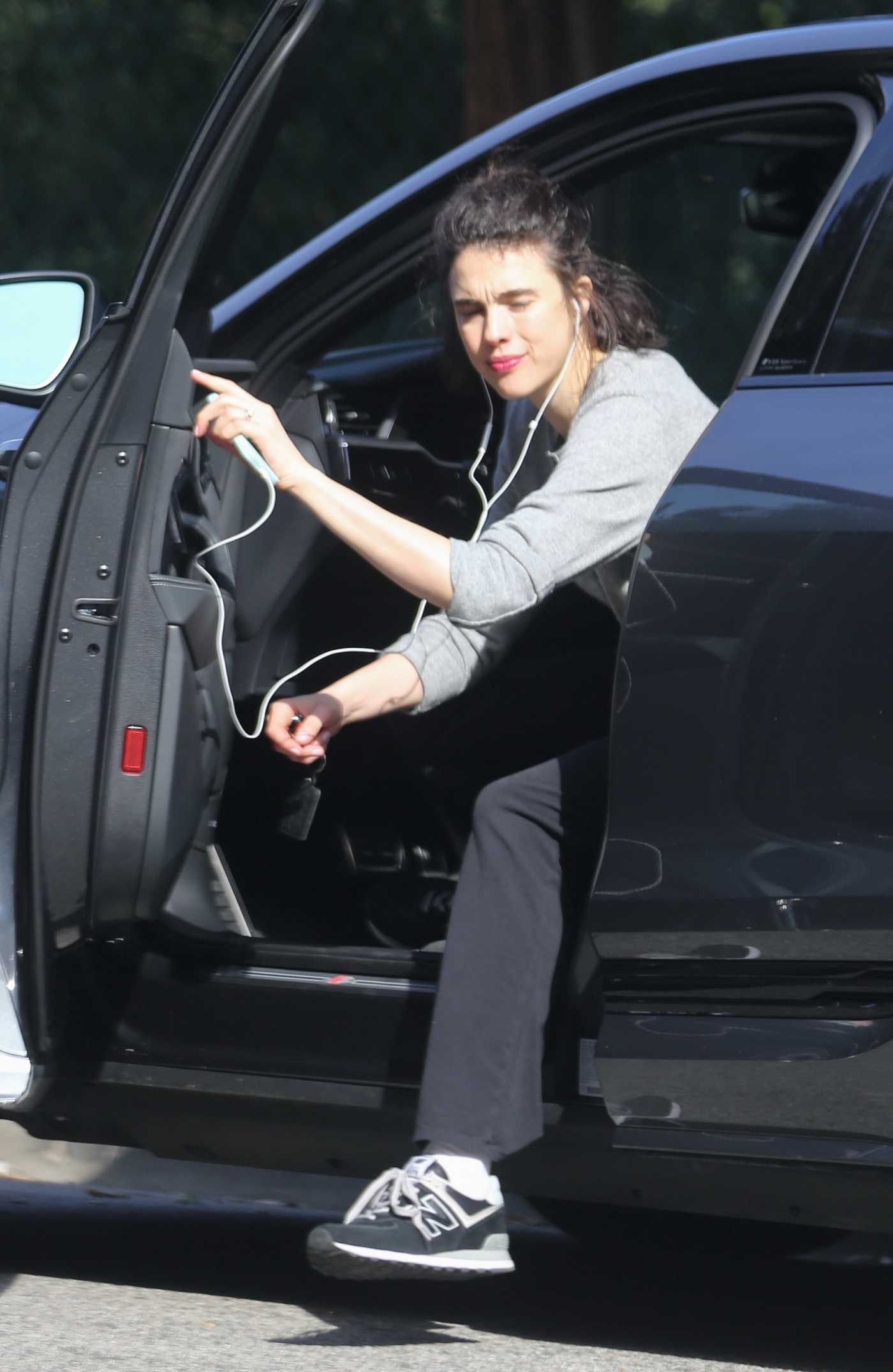Margaret Qualley in a Grey Cardigan Parks Her Car in the Heart of Beverly Hills 01/31/2024