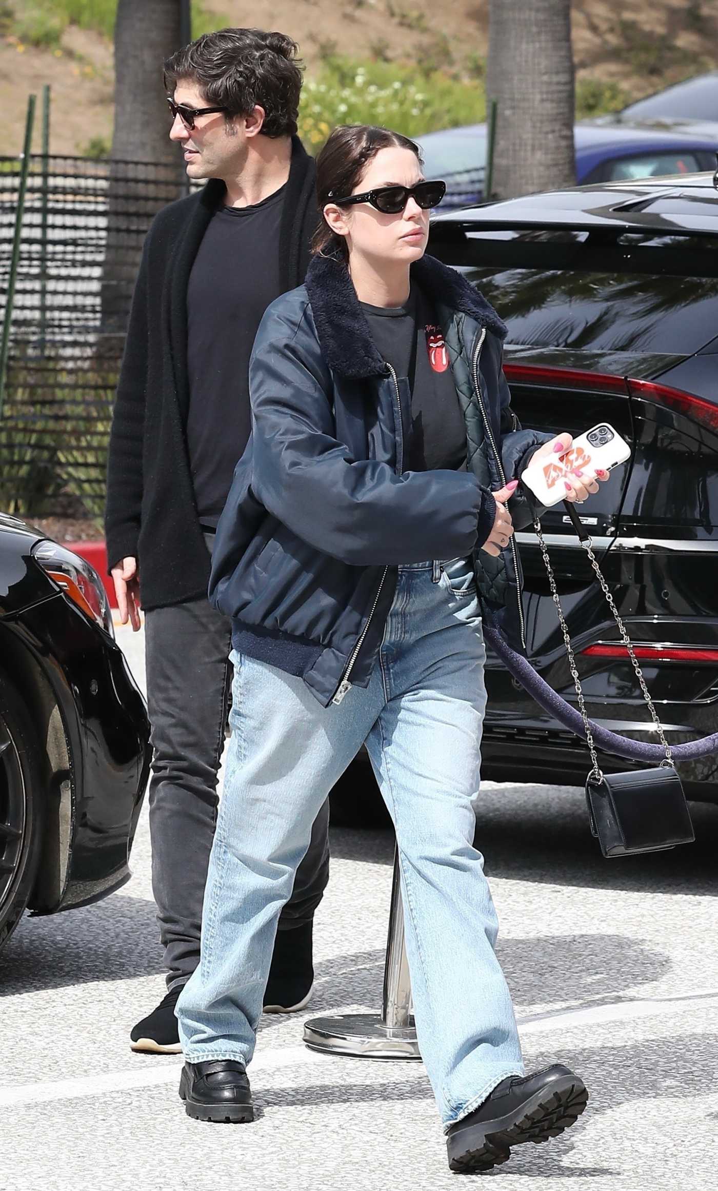 Ashley Benson in a Blue Bomber Jacket Was Seen Out with Husband Brandon Davis in Los Angeles 03/16/2024