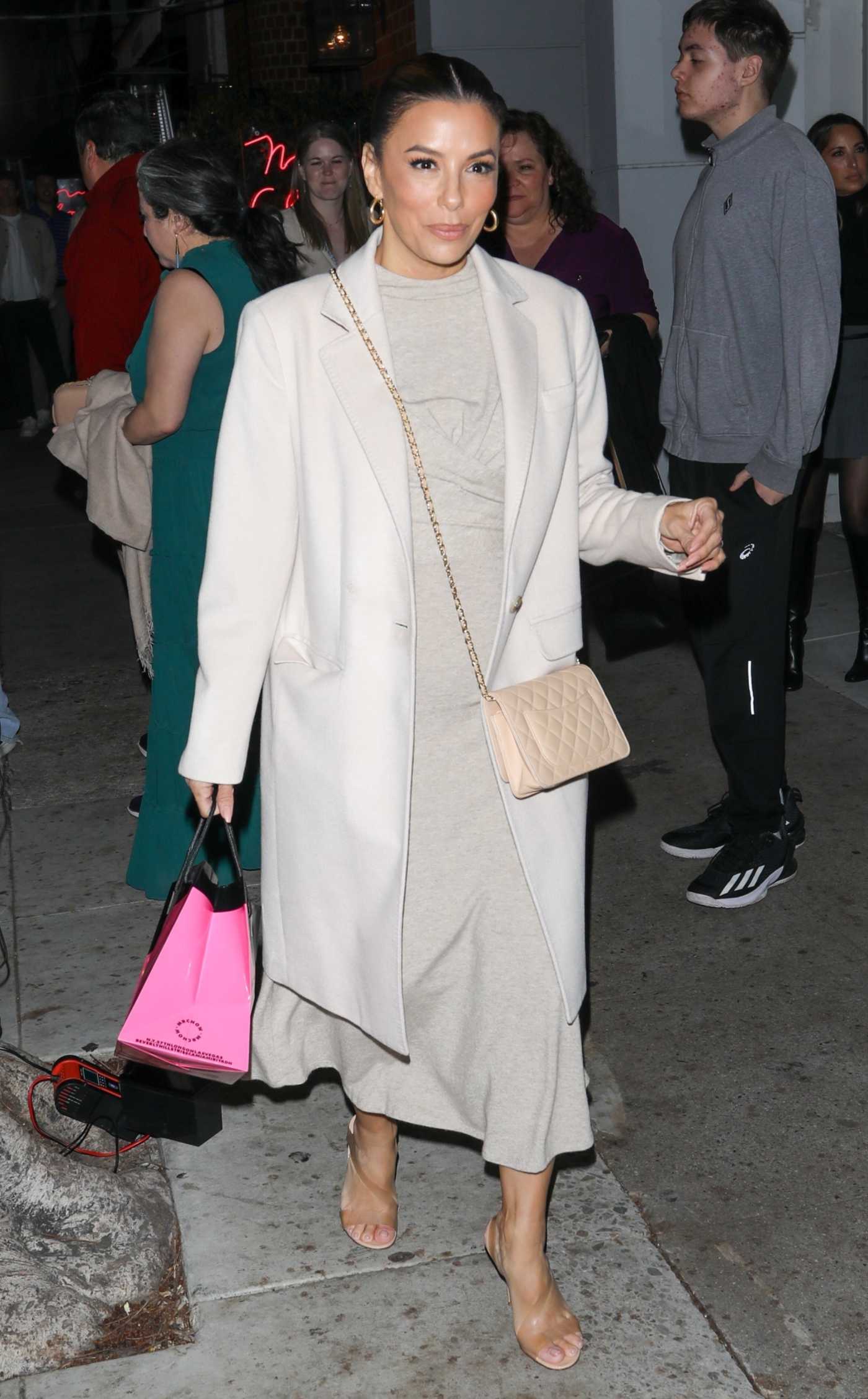 Eva Longoria in a White Coat Leaves Mr. Chow Restaurant in Beverly Hills 03/12/2024