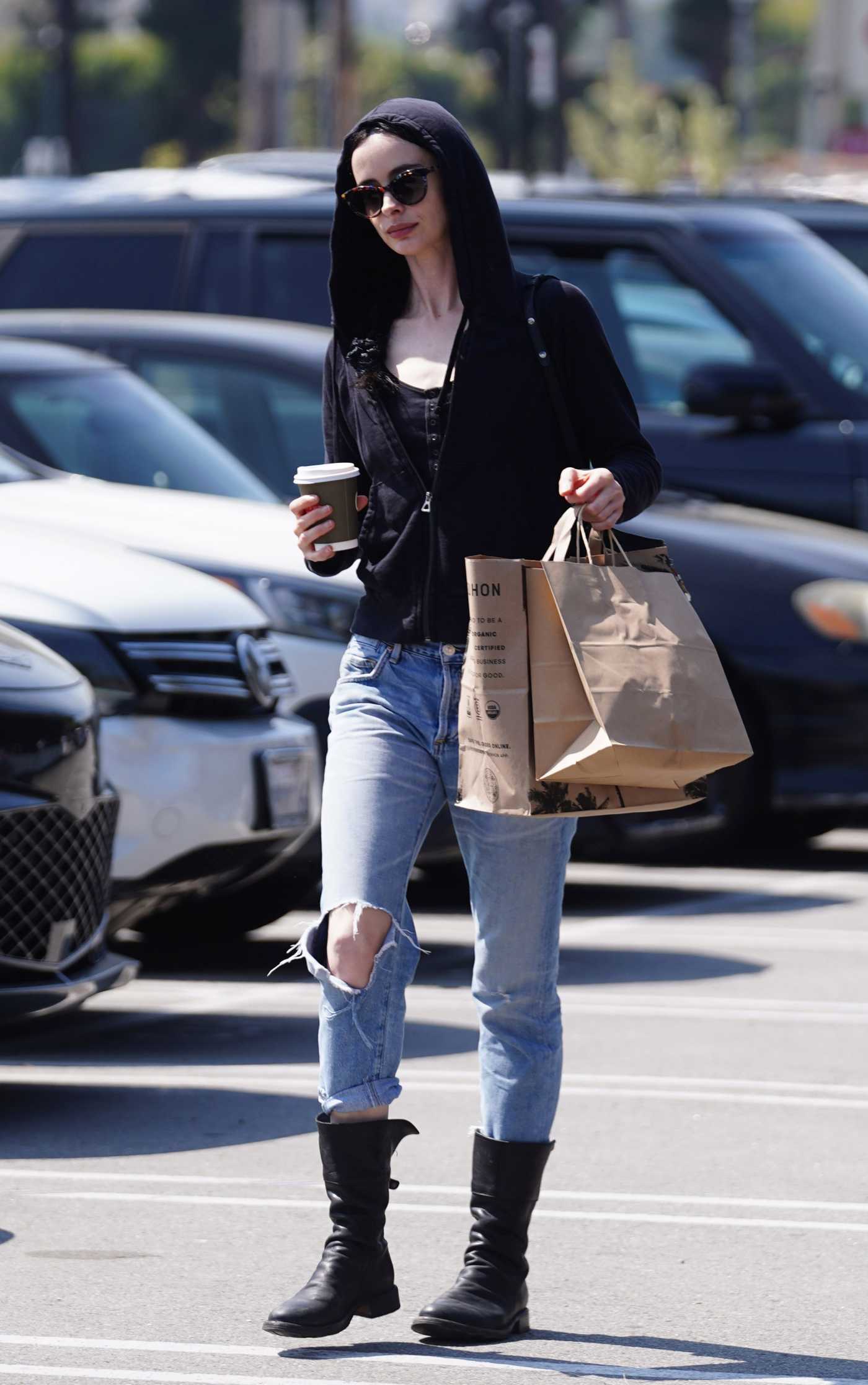 Krysten Ritter in a Blue Ripped Jeans Stops for Coffee and Groceries in Studio City 03/22/2024