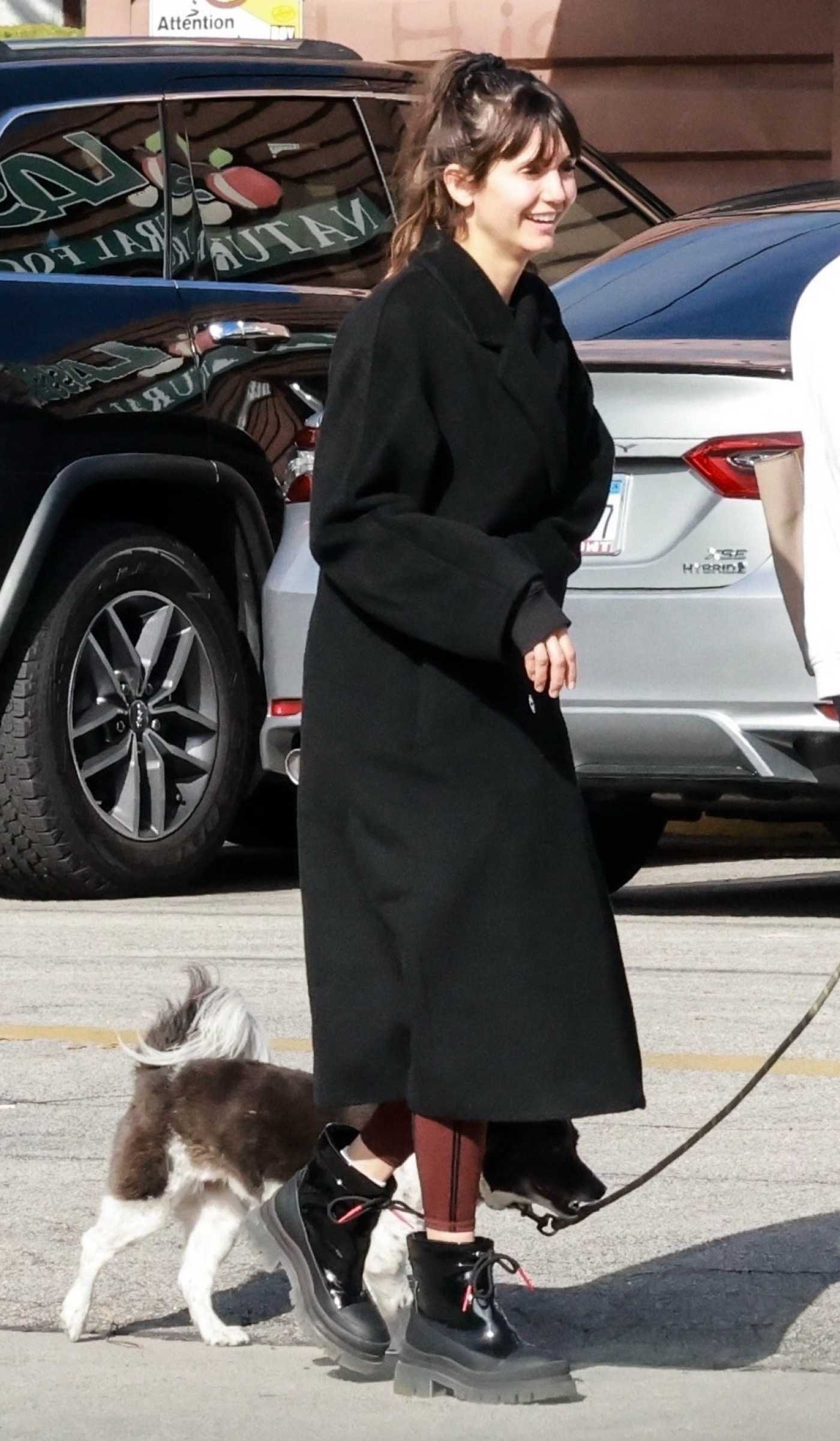 Nina Dobrev in a Black Coat Was Seen Out with a Friend in Los Feliz 03/30/2024