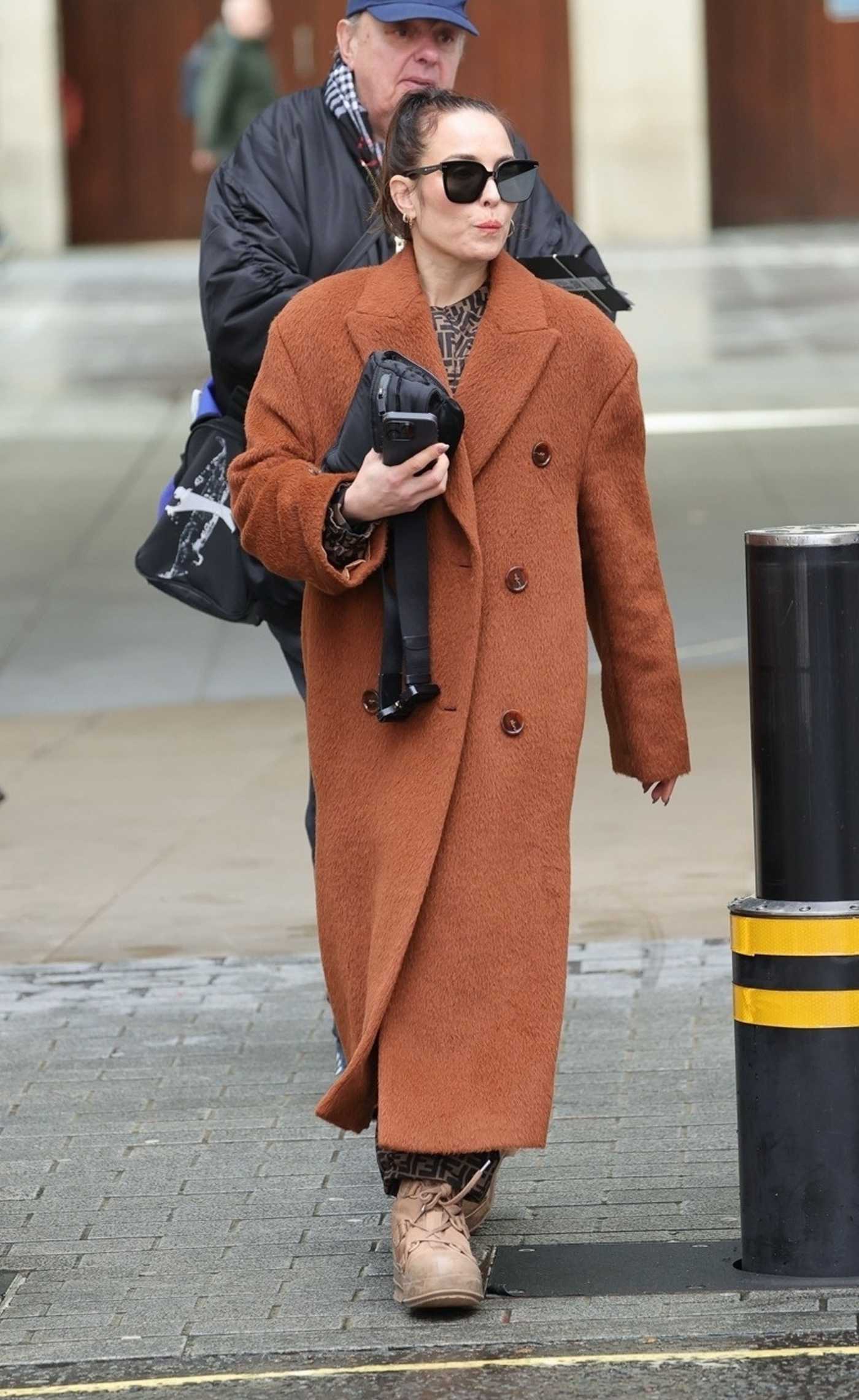 Noomi Rapace in an Orange Coat Was Seen Out in London 03/01/2024
