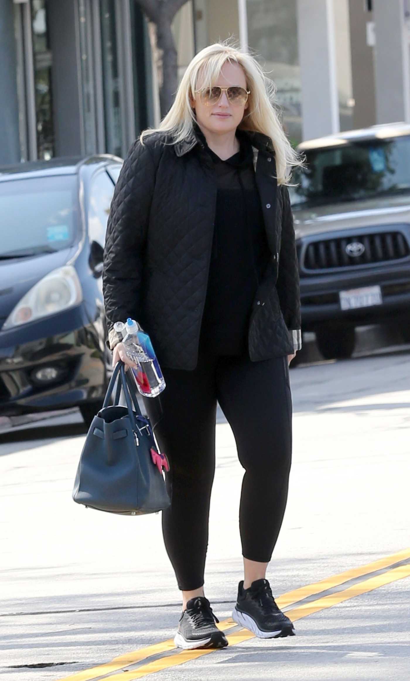 Rebel Wilson in a Black Outft while Stopping by Amavi Artistry Salon in Beverly Hills 03/29/2024