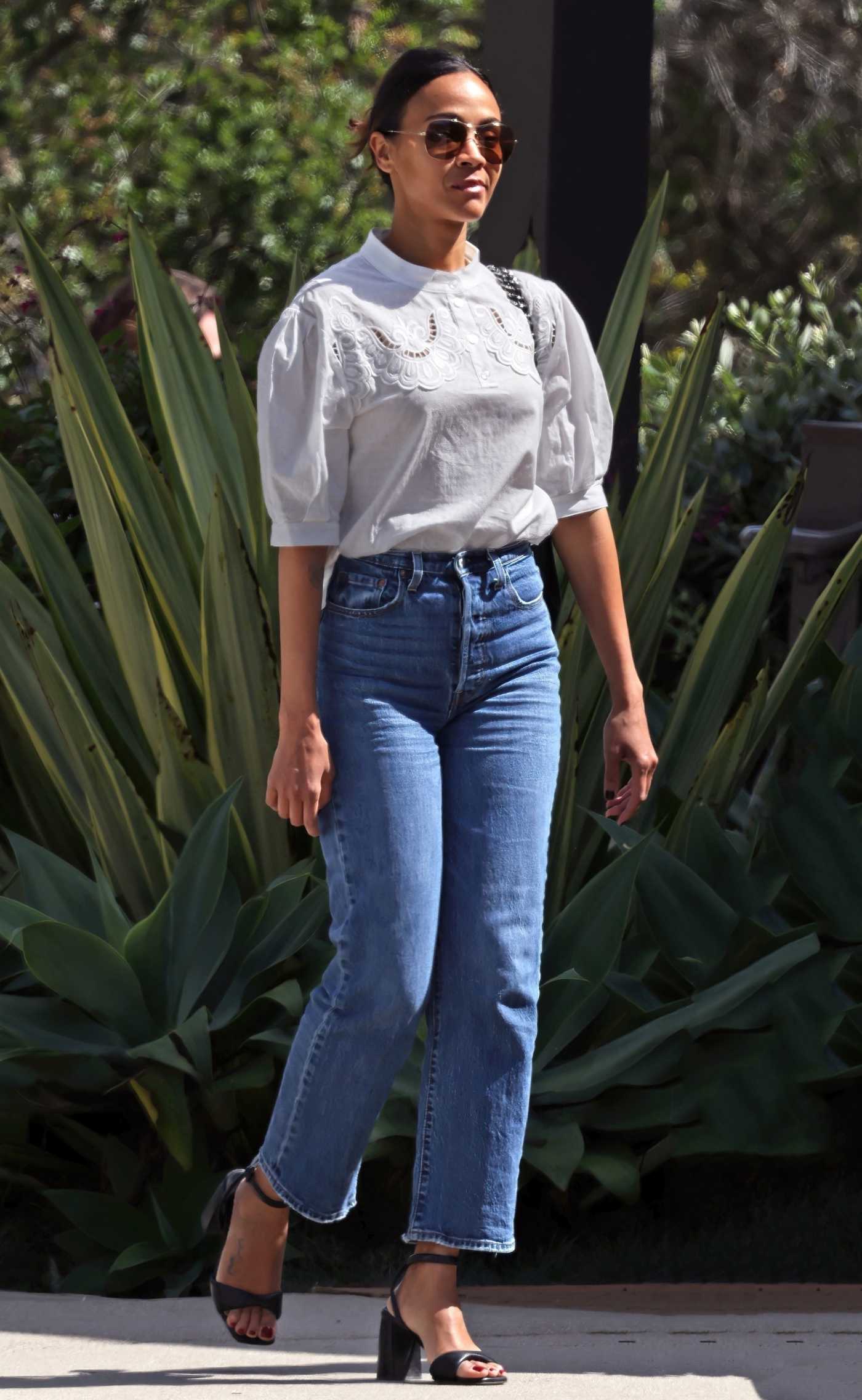 Zoe Saldana in a White Blouse Arrives for Lunch with Friends at The Honor Bar in Montecito 03/18/2024