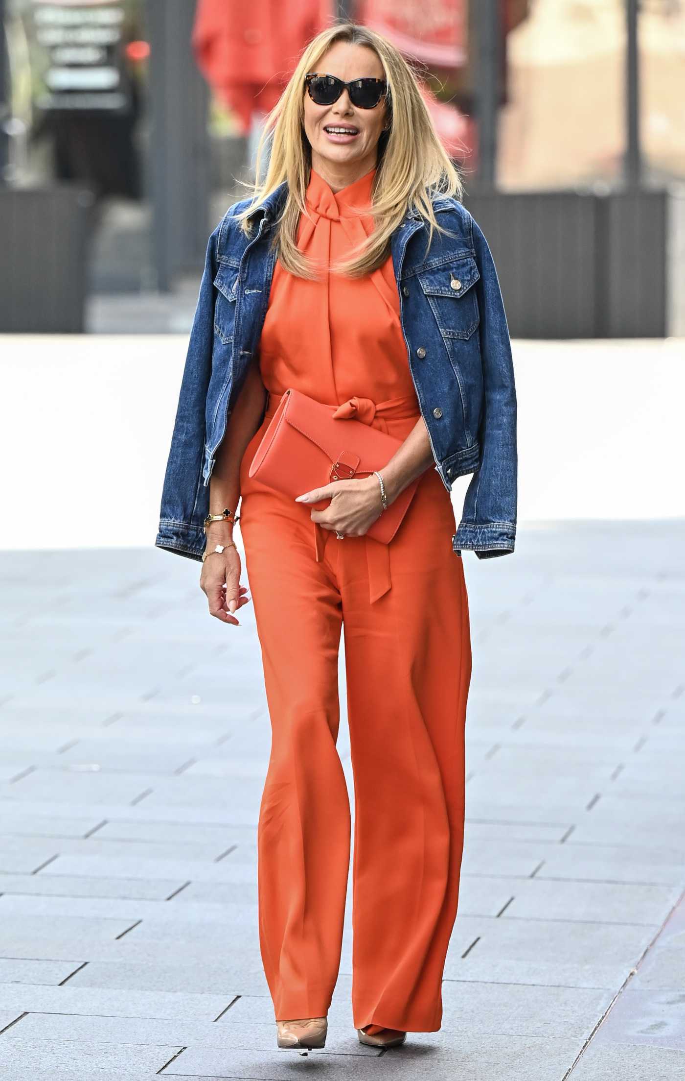 Amanda Holden in an Orange Jumpsuit Exiting  the Global Radio Studios in London 04/26/2024