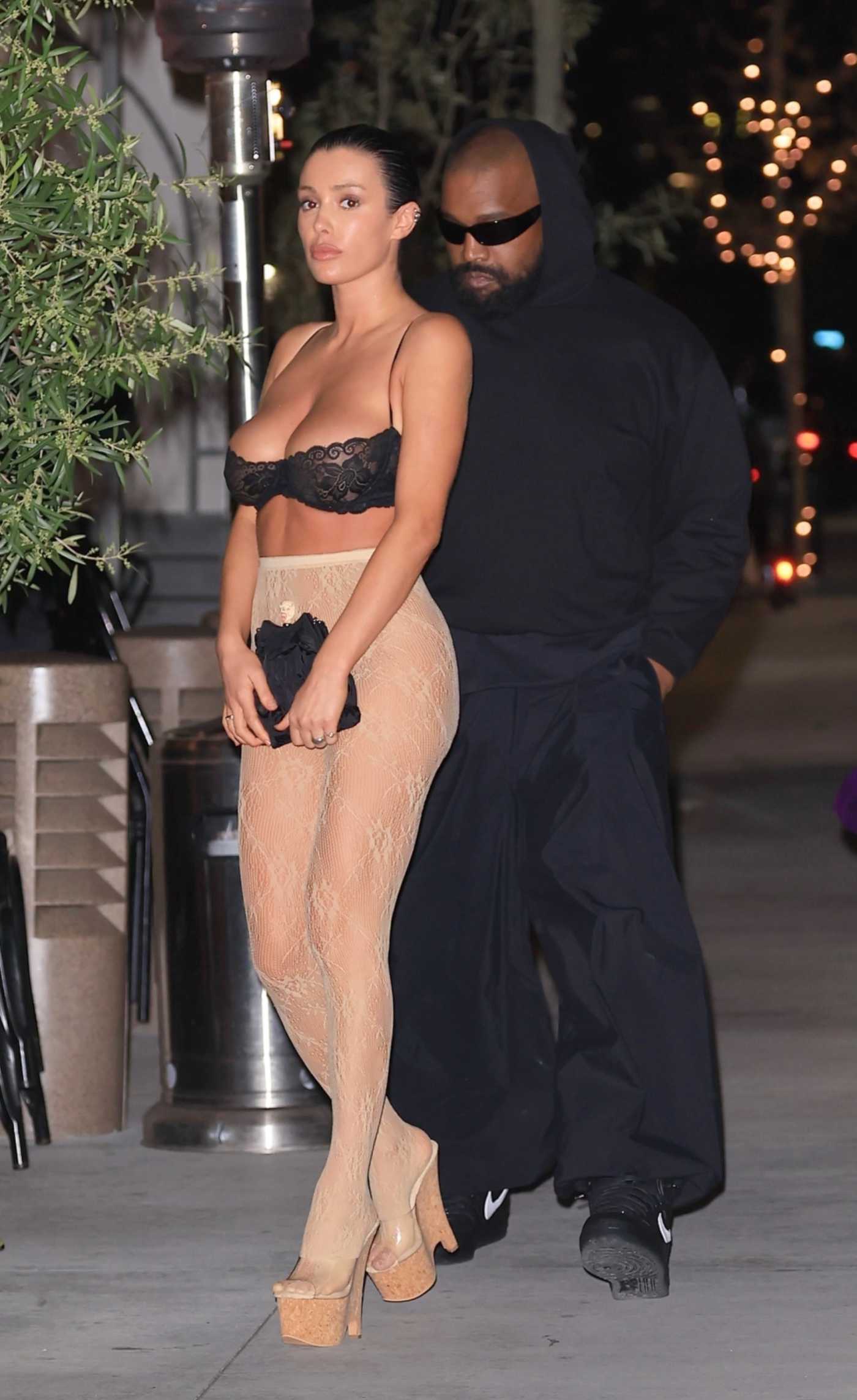 Bianca Censori in a Black Bra Enjoying Dinner at Gigi's with Kanye West in Los Angeles 04/04/2024