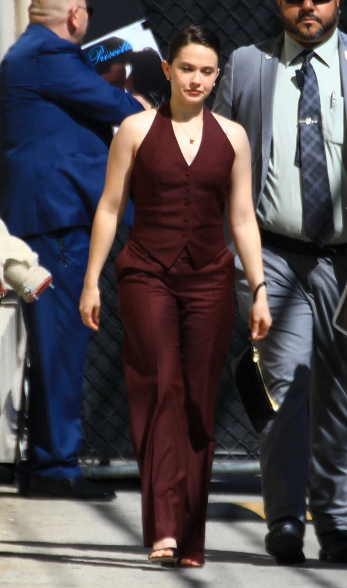 Cailee Spaeny in a Burgundy Suit Arrives for an Appearance on Jimmy Kimmel Live in Hollywood 04/03/2024