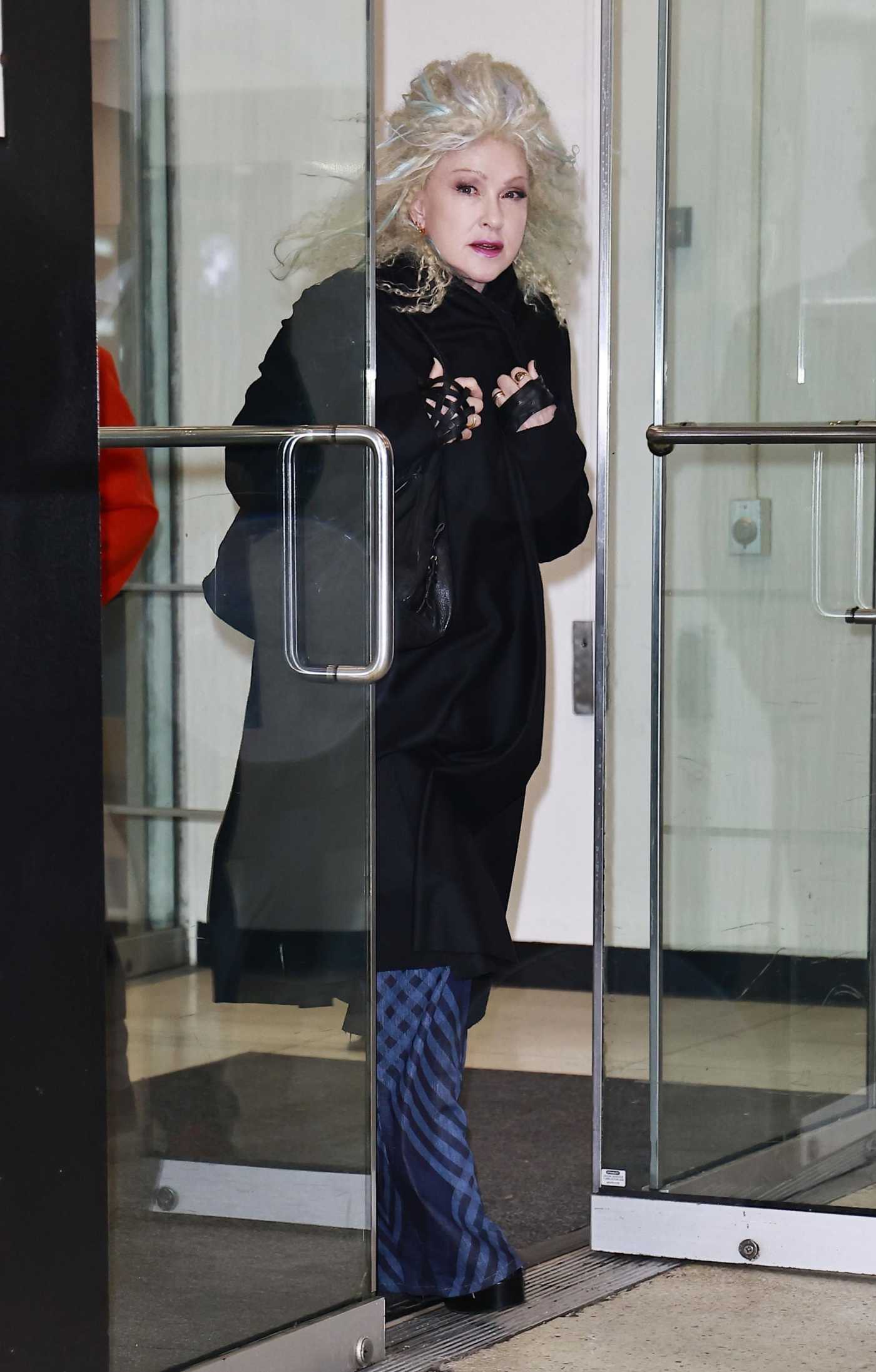 Cyndi Lauper in a Black Coat Exits the Drew Barrymore Show in New York 04/03/2024