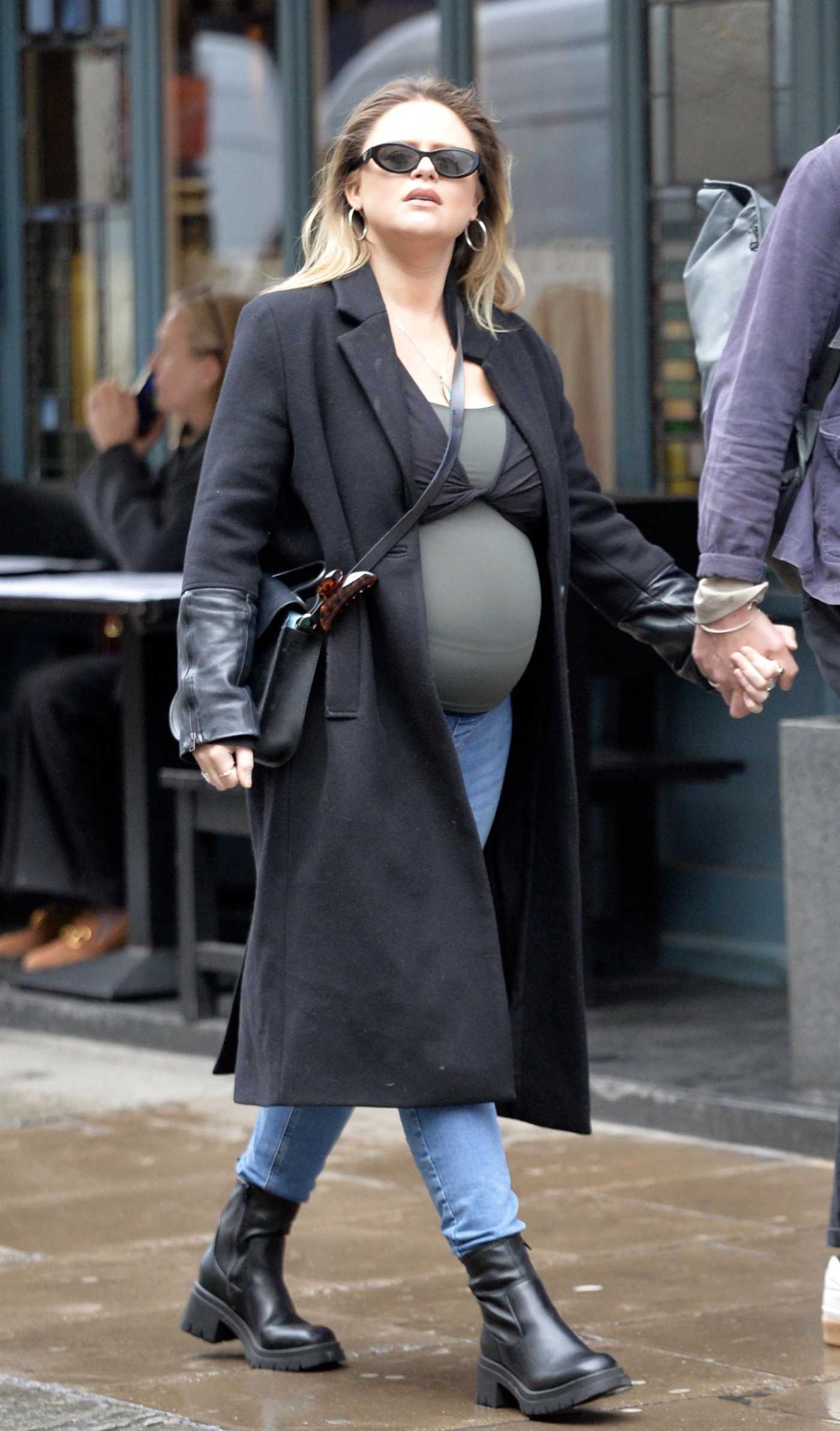 Emily Atack in a Black Coat Was Seen Out with Alistair Garner in London 04/04/2024