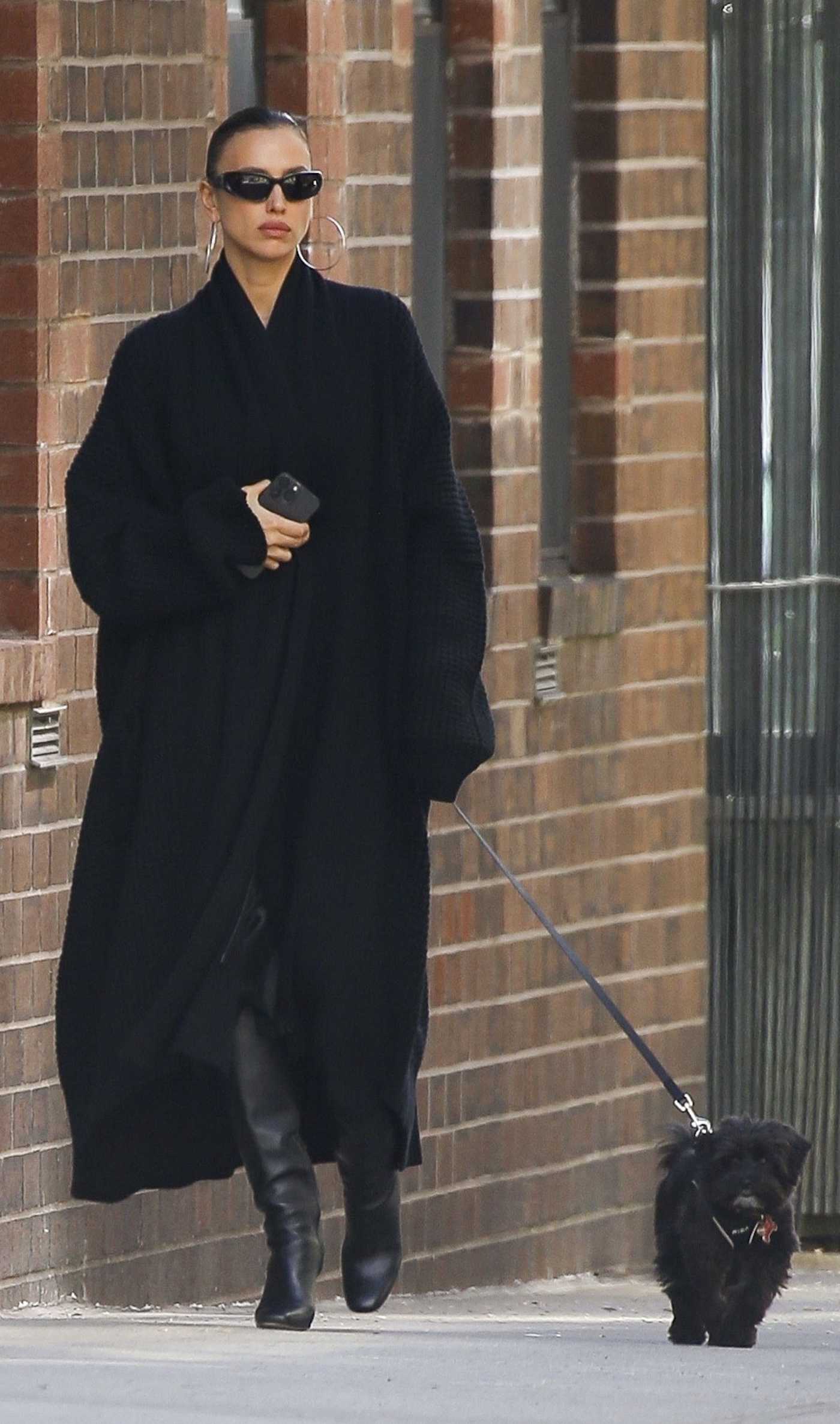 Irina Shayk in a Black Cardigan Walks Her Dog in New York 04/04/2024