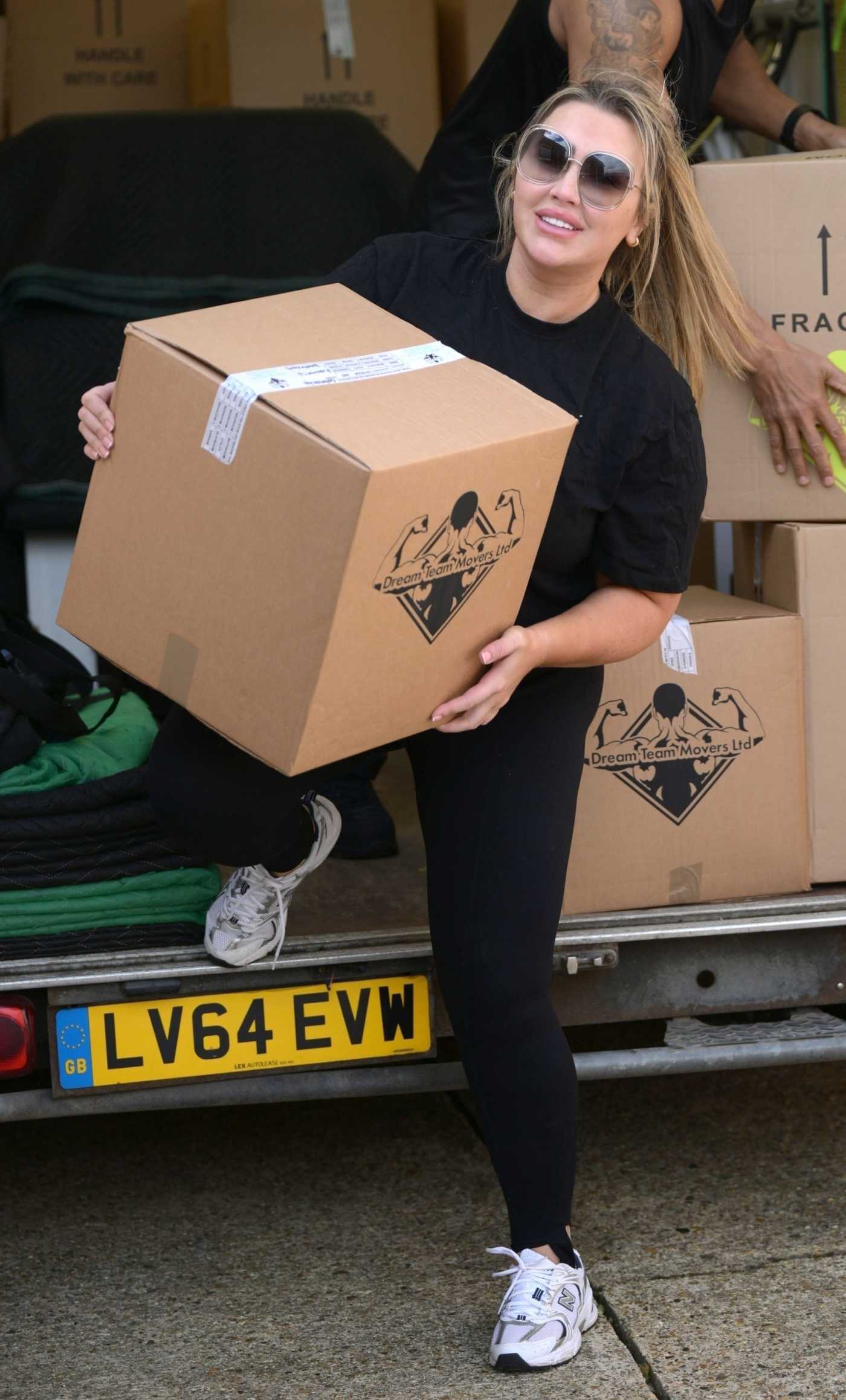 Lauren Goodger in a Black Tee Was Seen During Moving House in Essex 04/05/2024