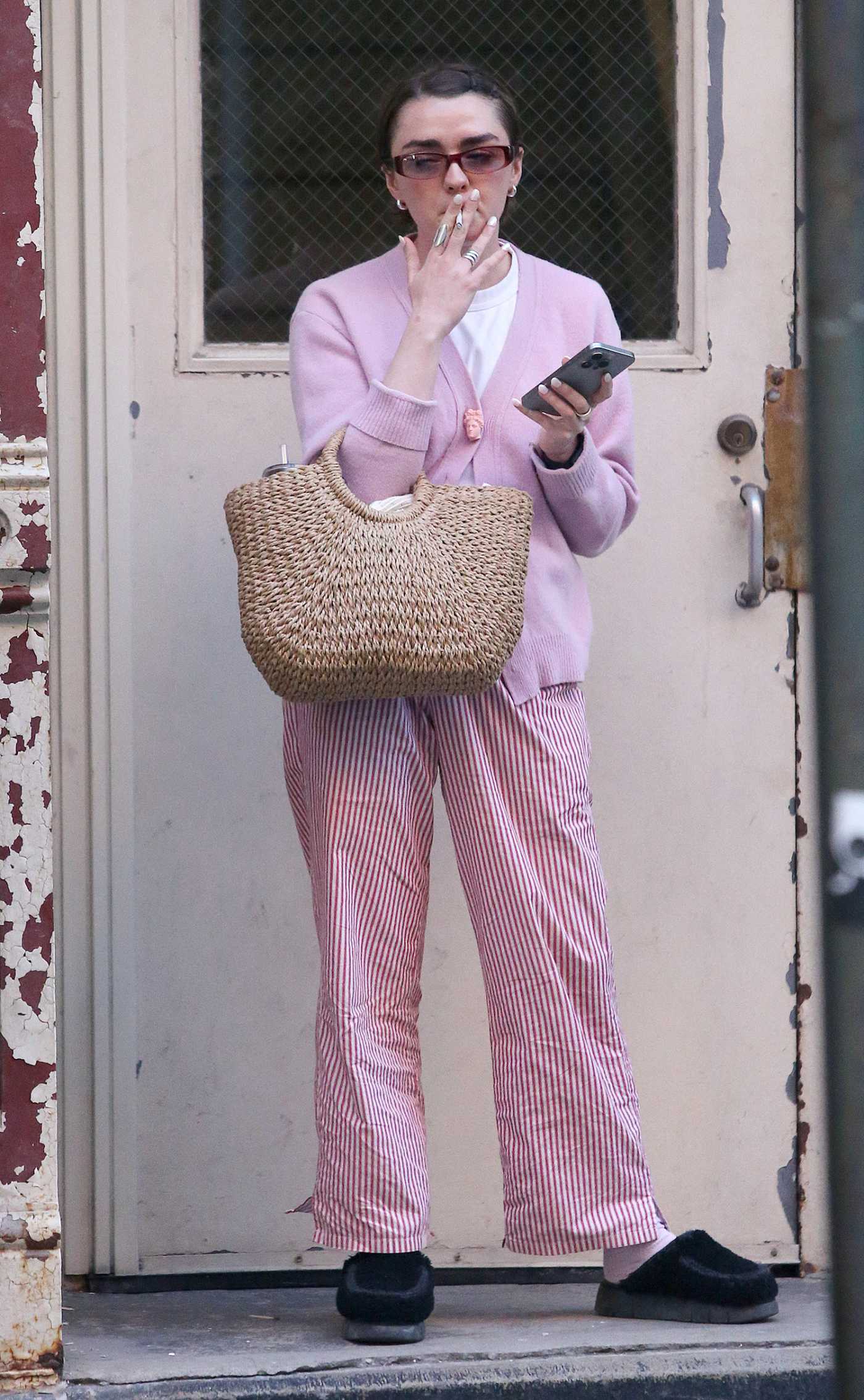 Maisie Williams in a Purple Cardigan Was Seen Out in New York City 04/25/2024