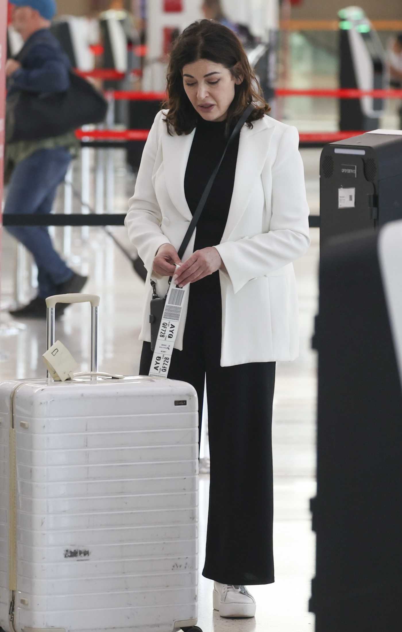 Nigella Lawson in a White Blazer Arrives at Kingsford Smith Airport in Sydney 04/08/2024