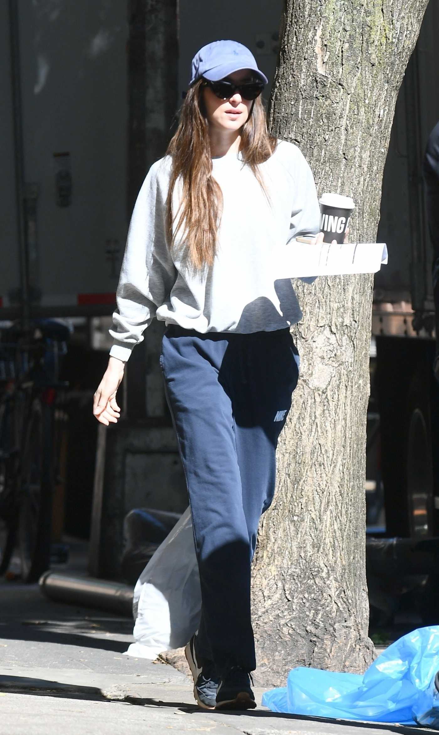 Dakota Johnson in a Blue Cap Was Seen Out in New York 05/29/2024