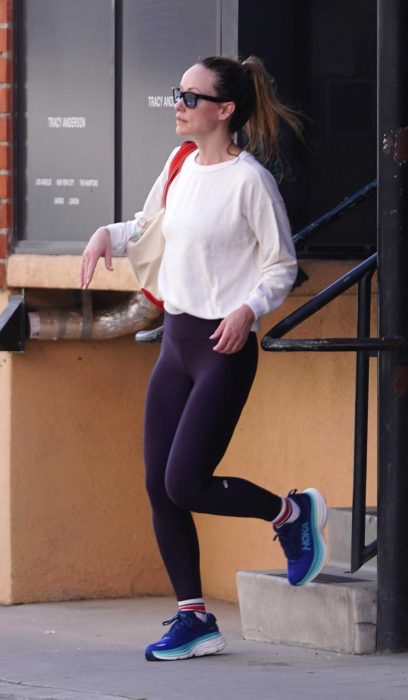 Olivia Wilde in a Purple Leggings