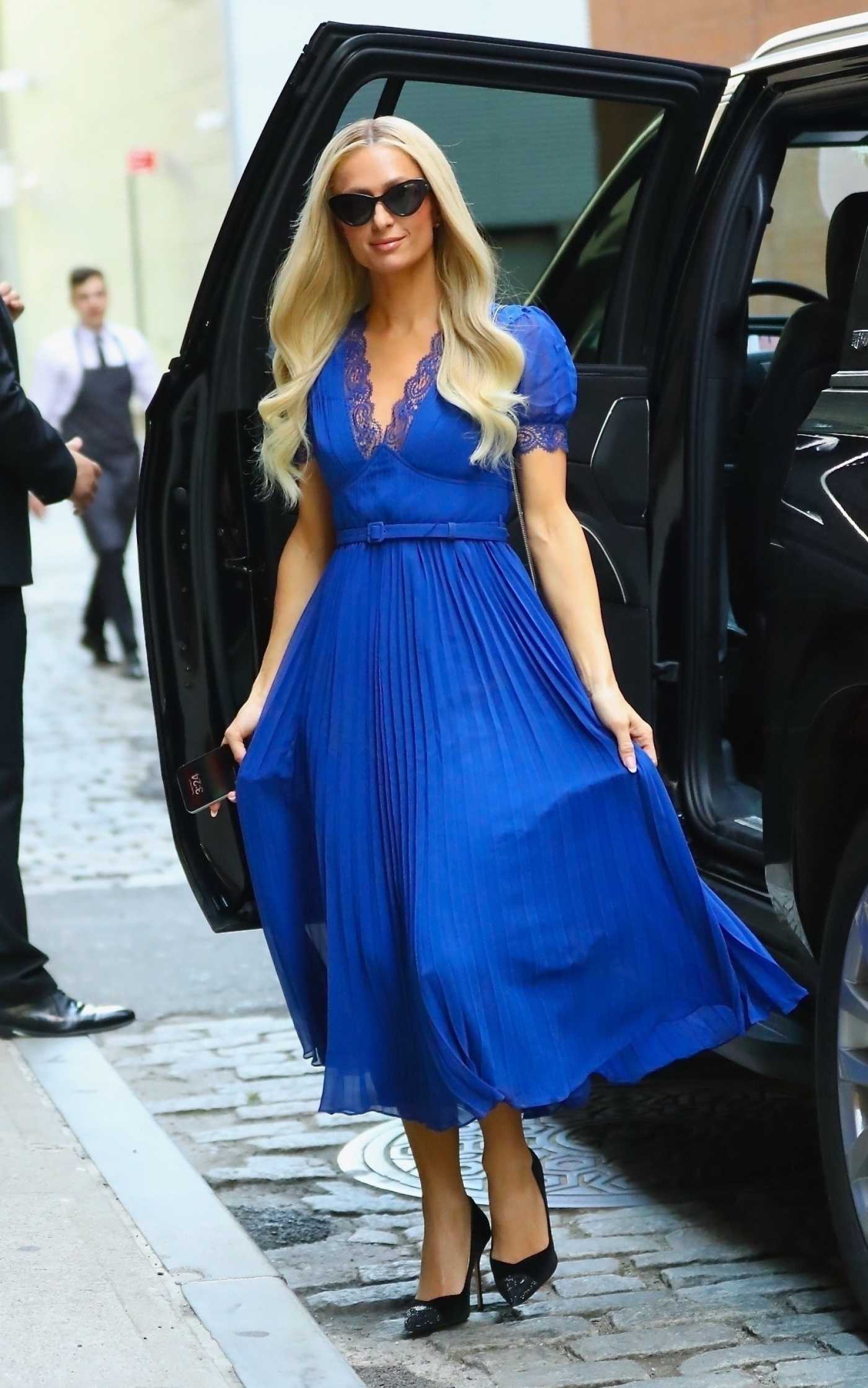 Paris Hilton in a Blue Dress Arrives at The Wall Street Journal's The Future of Everything Festival in New York City 05/21/2024