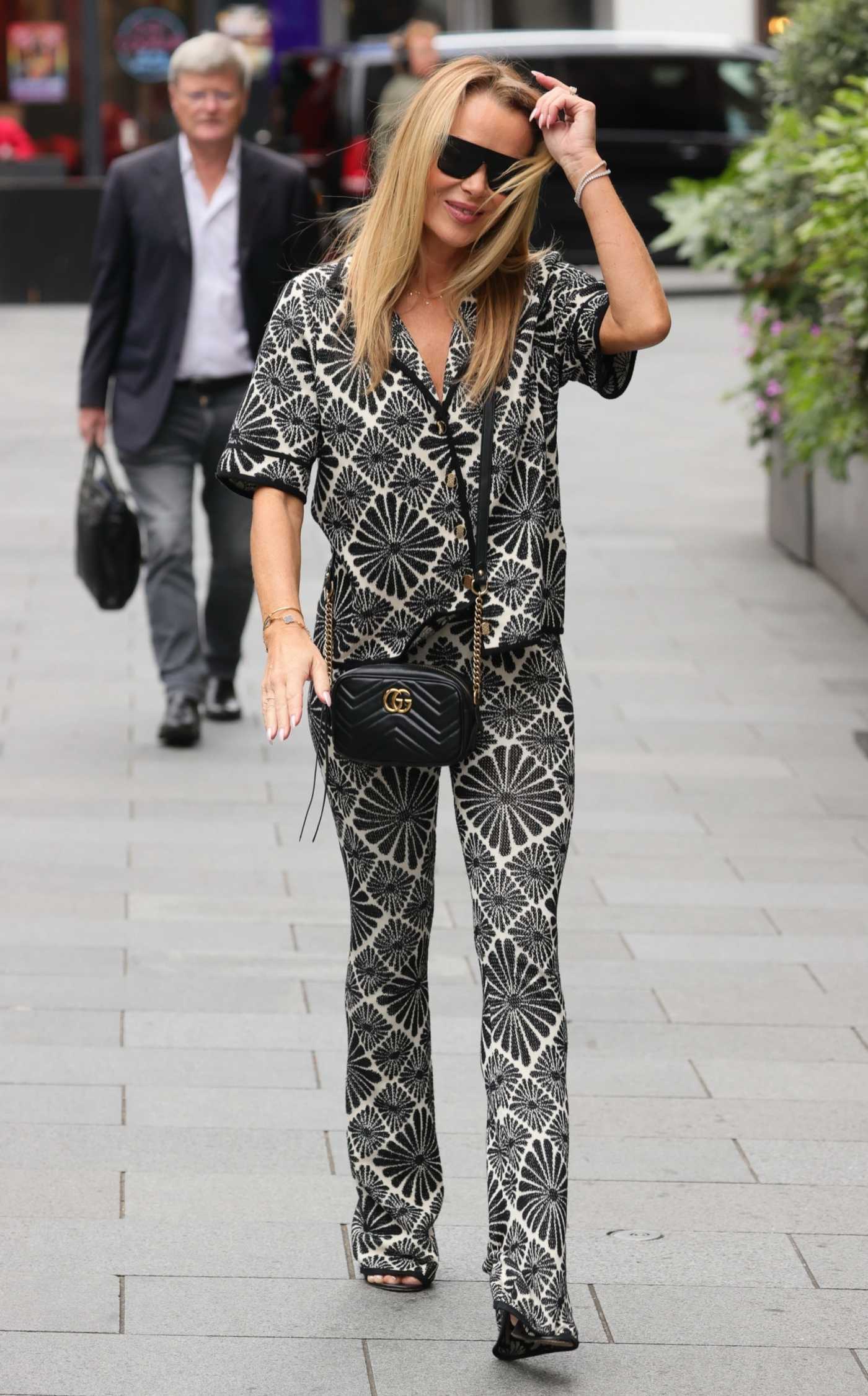Amanda Holden in a Patterned Pantsuit Leaves the Heart Radio in London 05/31/2024