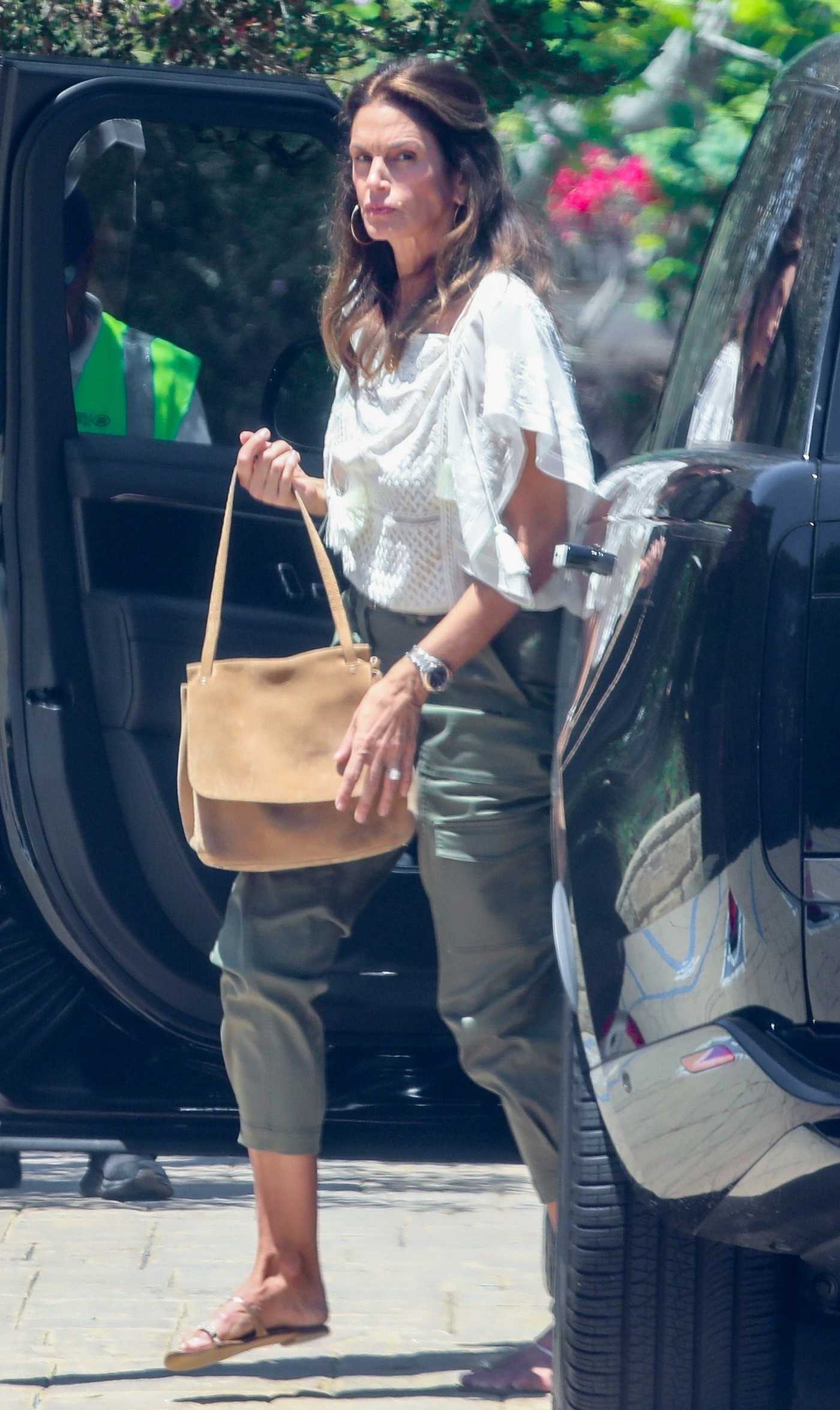 Cindy Crawford in a White Blouse Stobs by The Soho House in Malibu 06/25/2024