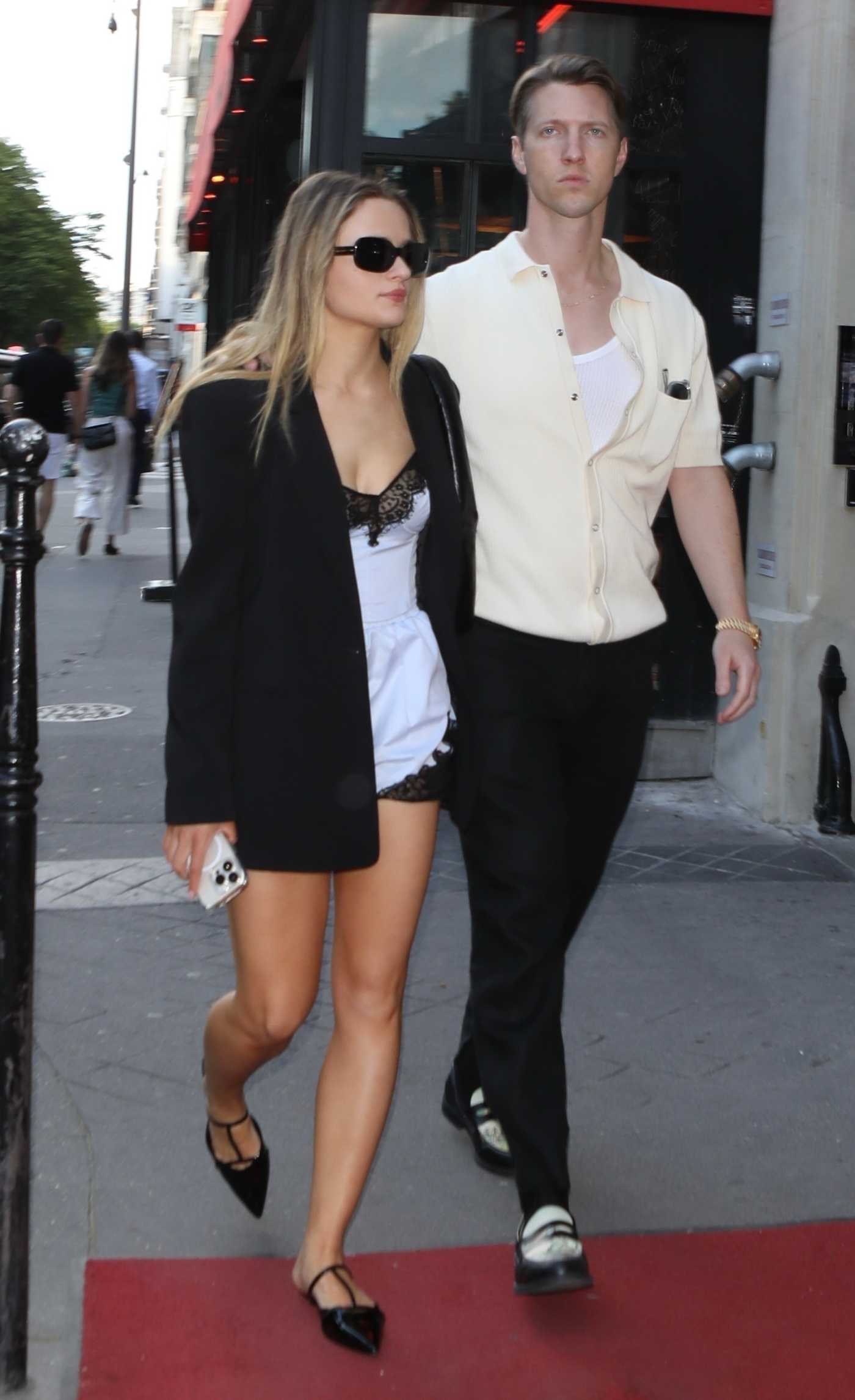 Joey King in a Black Blazer with Steven Piet Leaves the Crazy Horse Show in Paris 06/24/2024
