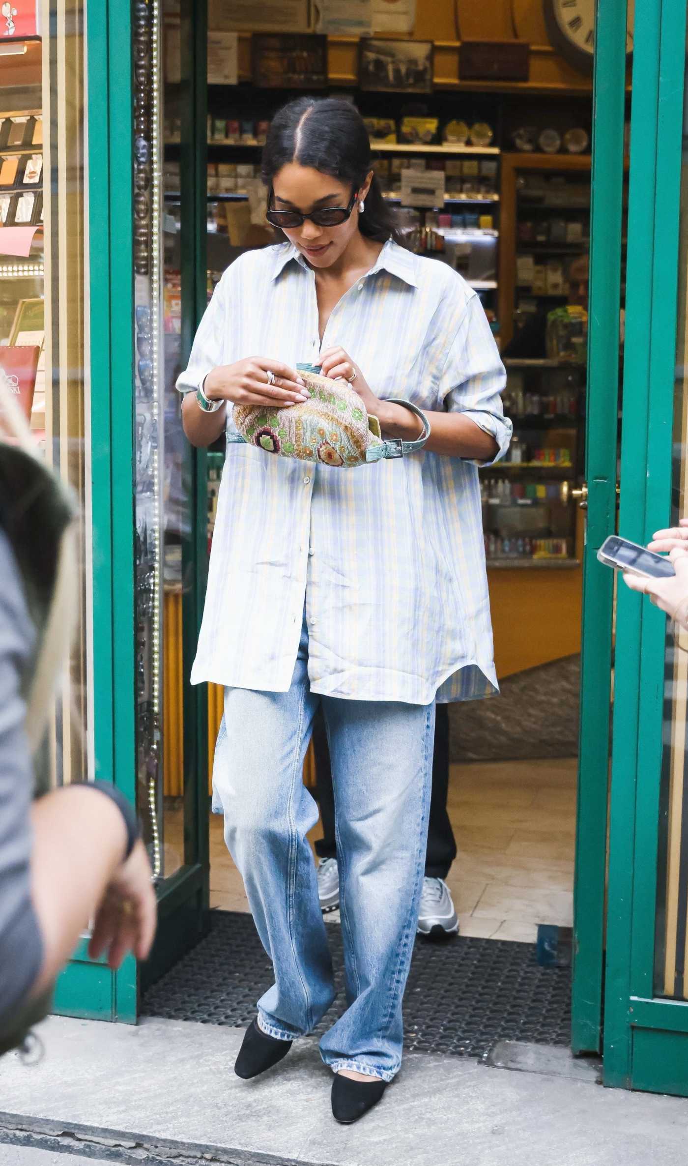 Laura Harrier in a Striped Shirt Goes for a Stroll with Her Fiance Sam Jarou Out in Milan 06/18/2024