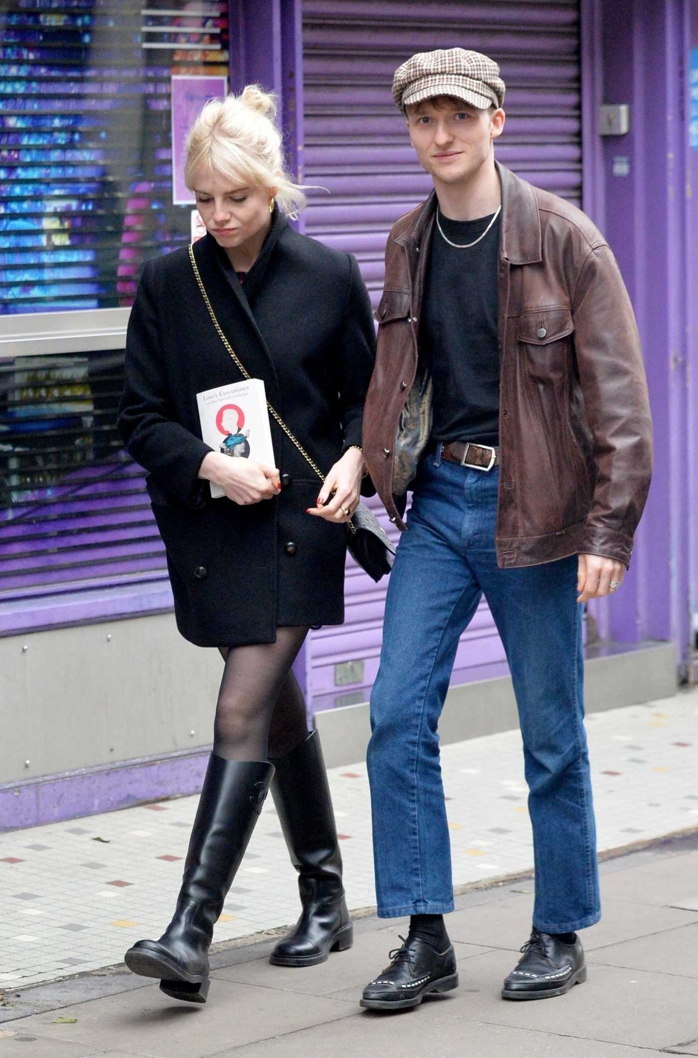 Lucy Boynton in a Black Coat Was Seen Out with Her Boyfriend Murdo Mitchell in Soho in London 05/28/2024