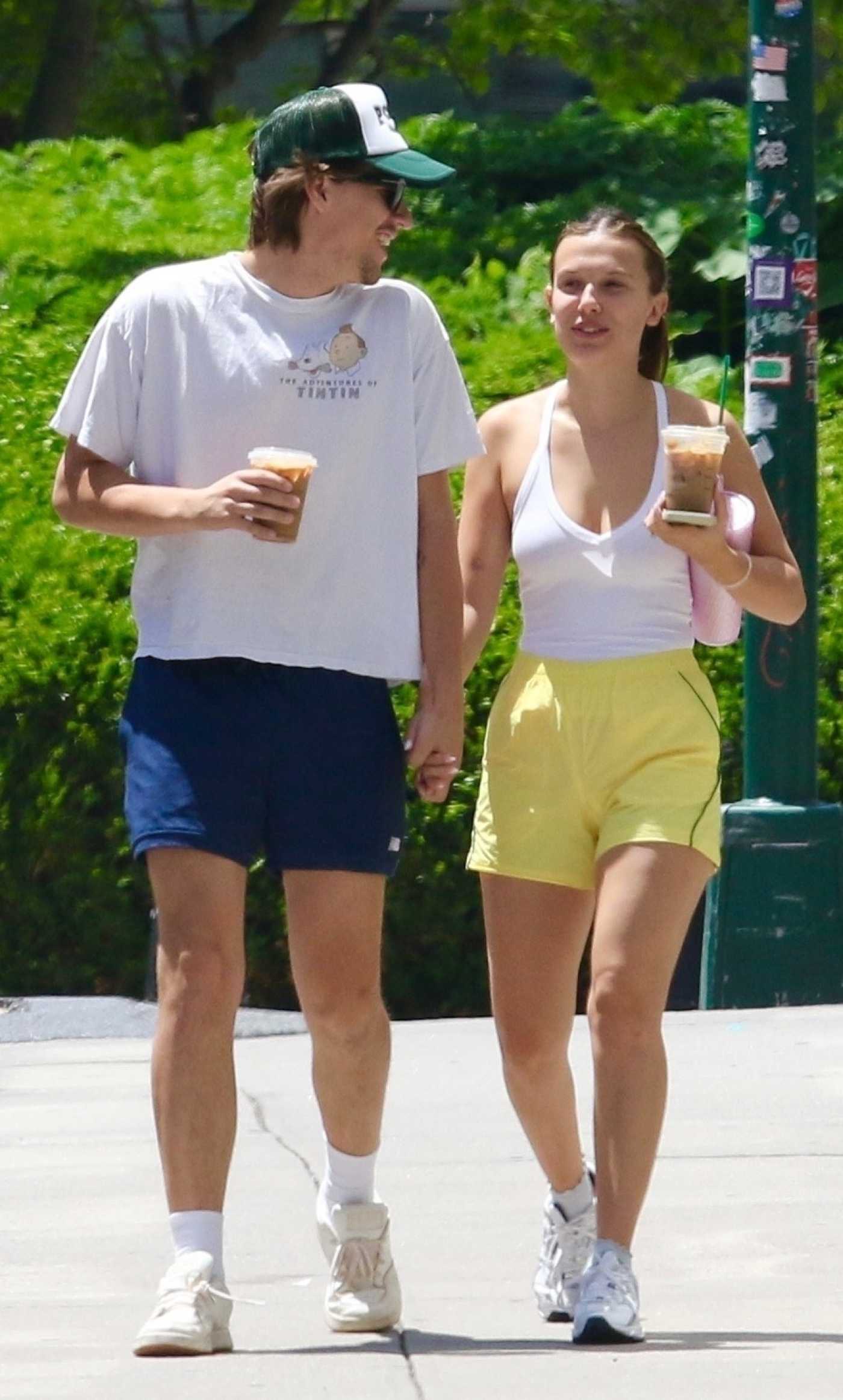 Millie Bobby Brown in a Yellow Shorts Was Seen Out for Stroll with Jacob Bongiovi in Manhattan in New York 06/13/2024
