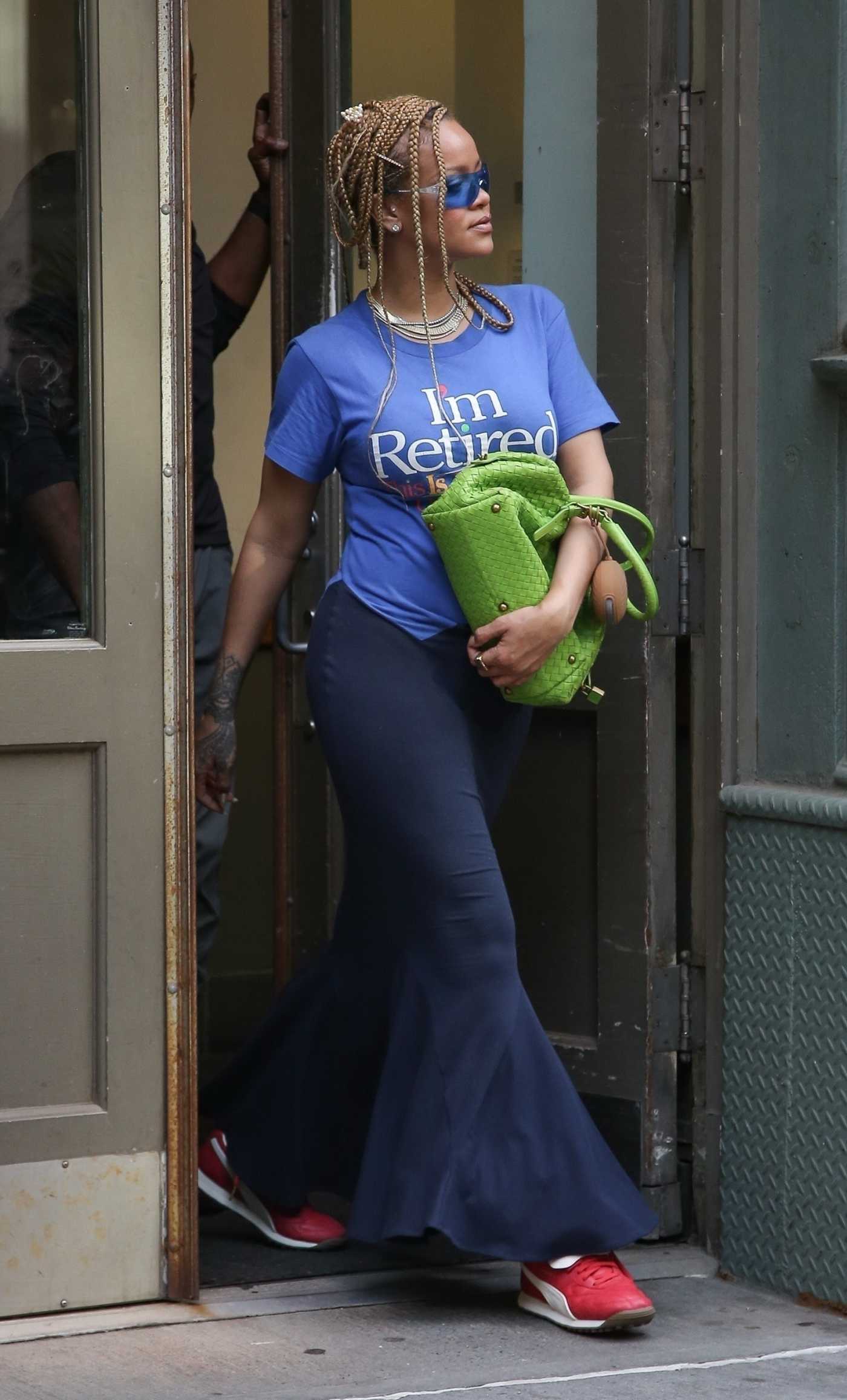 Rihanna in a Red Sneakers Leaves Her Apartment in New York 06/06/2024