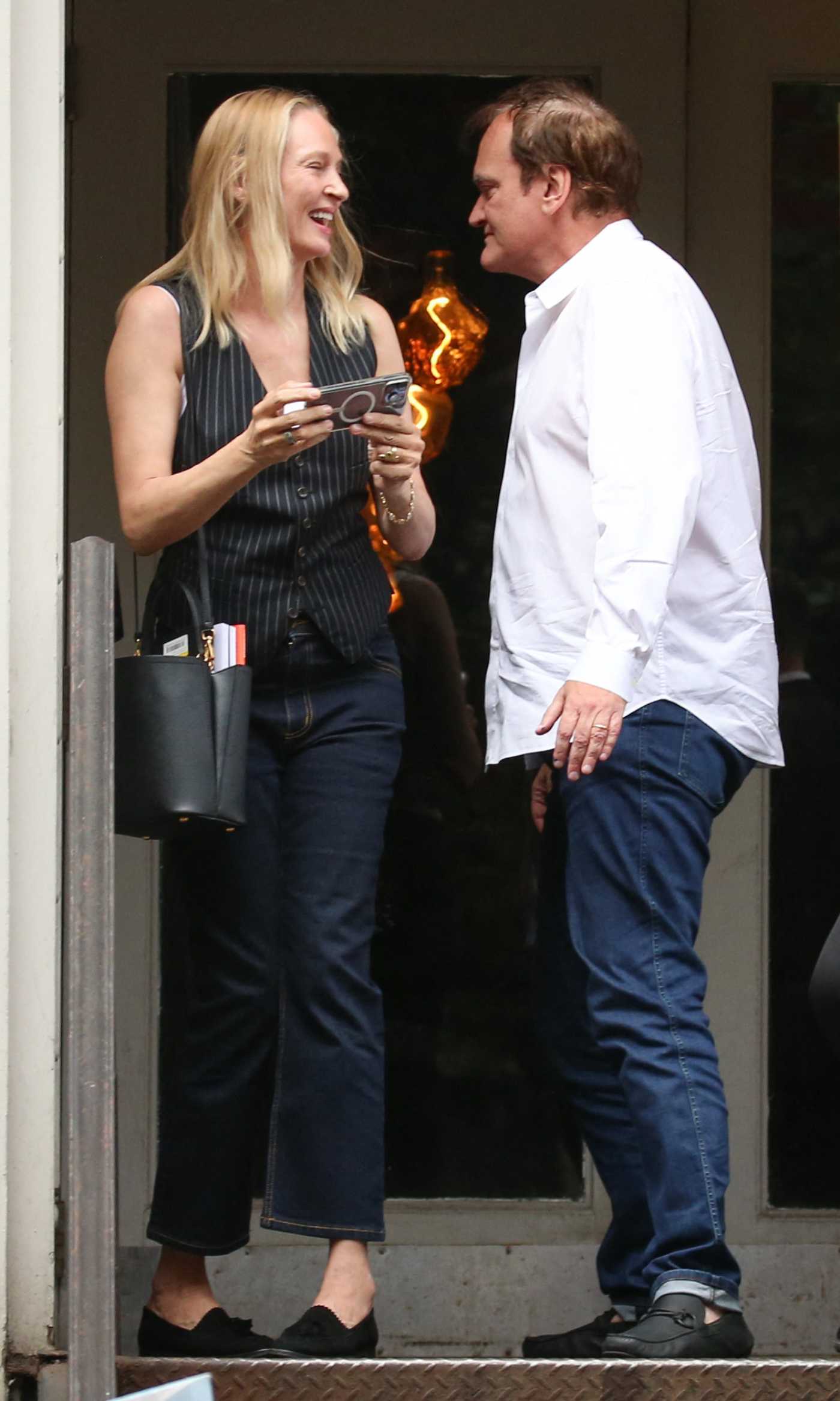 Uma Thurman in a Black Striped Vest Leaves a Chinese Restaurant with Quentin Tarantino in New York 06/14/2024