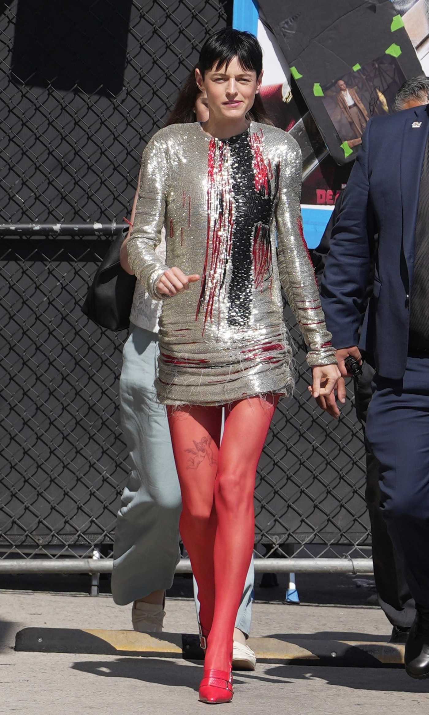 Emma Corrin in a Red Tights Arrives at Jimmy Kimmel Live in Hollywood 07/24/2024