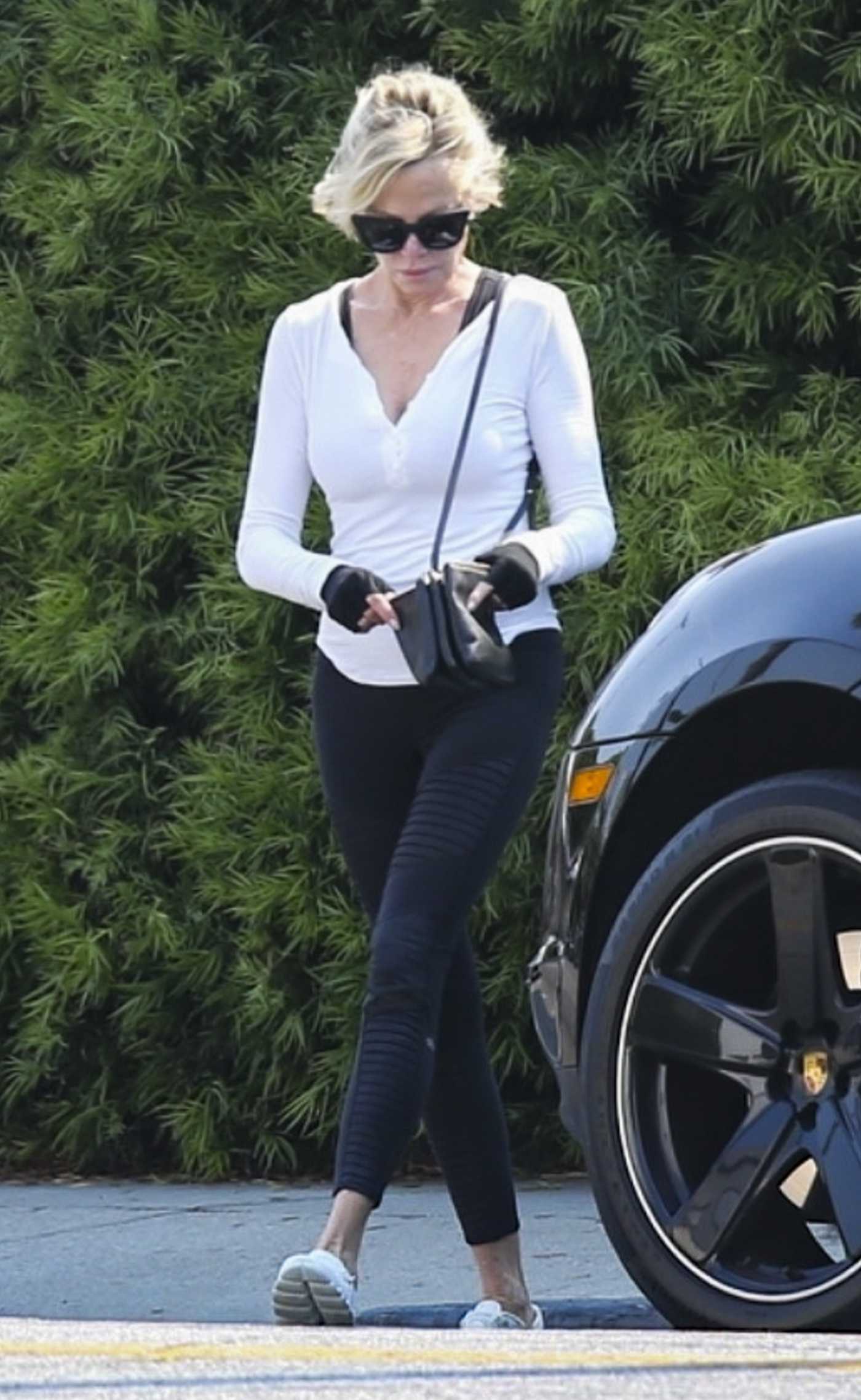 Melanie Griffith in a White Blouse Leaves the Gym in Los Angeles 07/11/2024
