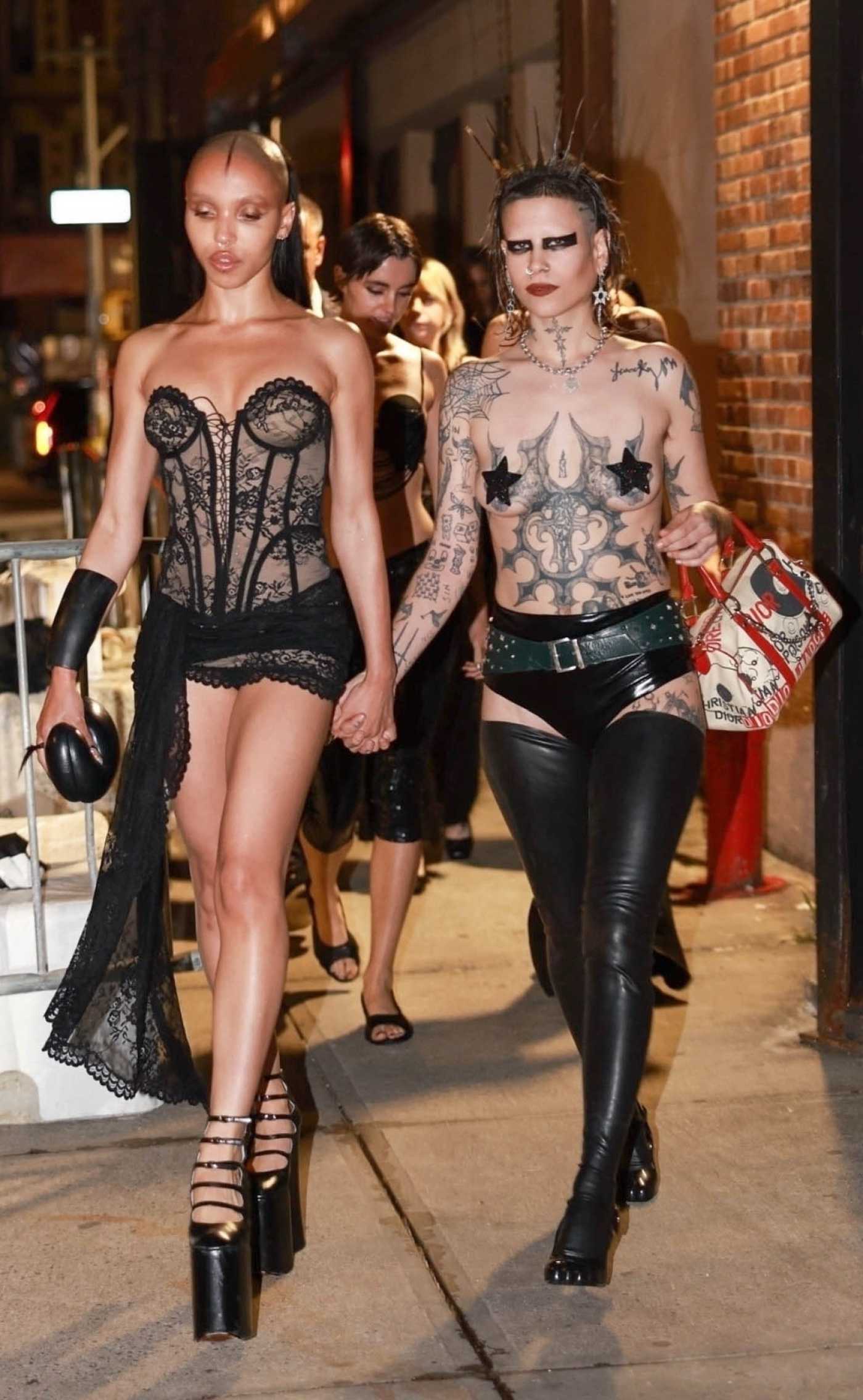 FKA Twigs in a Black Mini Dress Holds Hands with a Gothic Gal Out in New York 08/20/2024